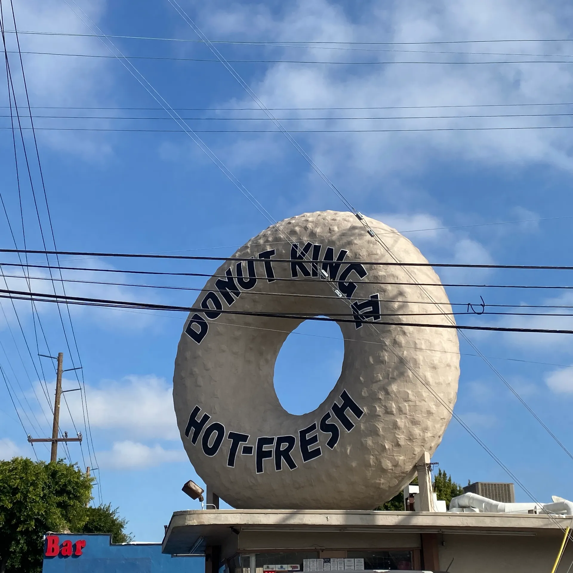 Giant donut sign atop Donut King II in Gardena, California.