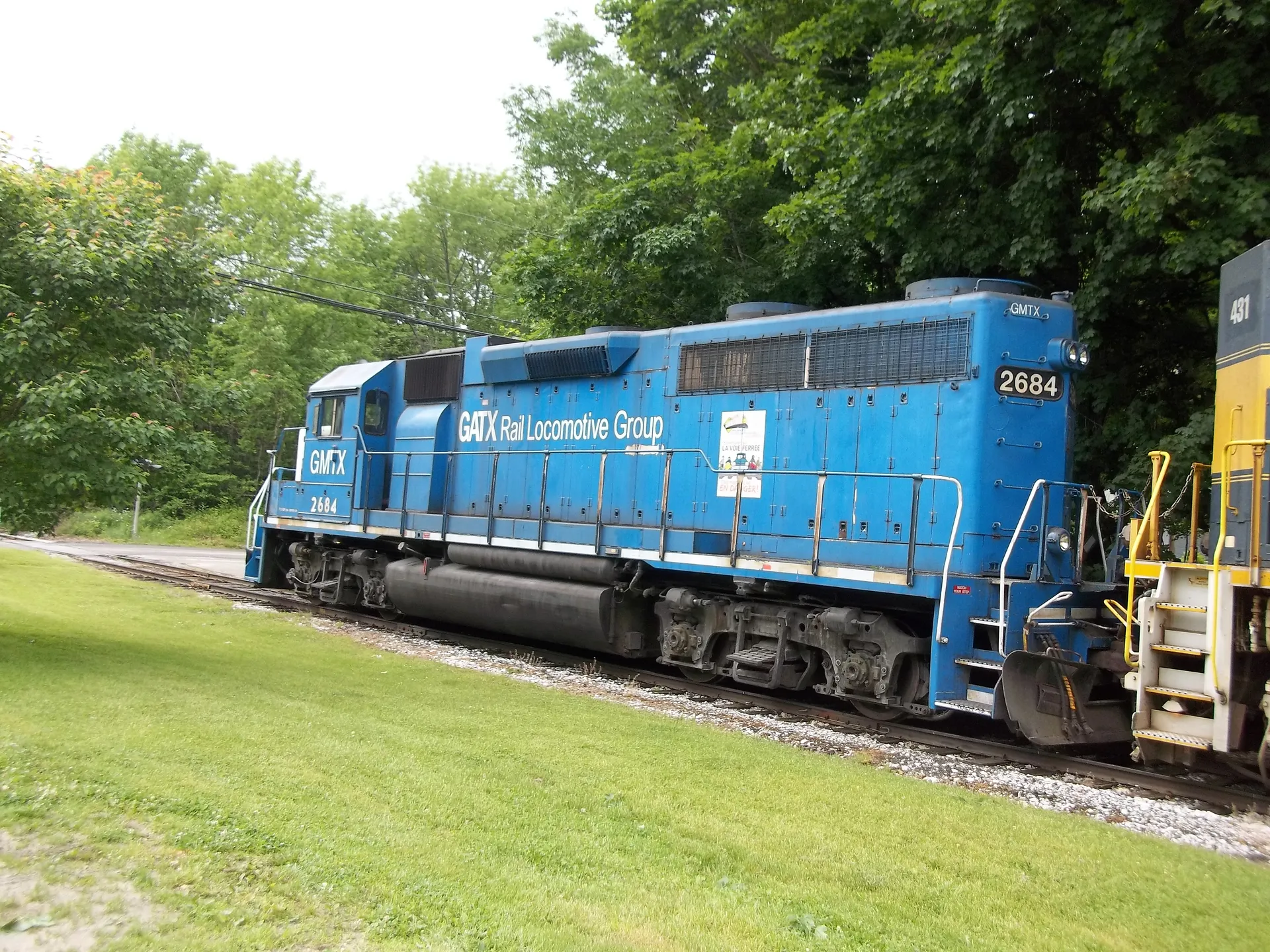 Blue GATX locomotive on the tracks in East Dorset, Vermont.