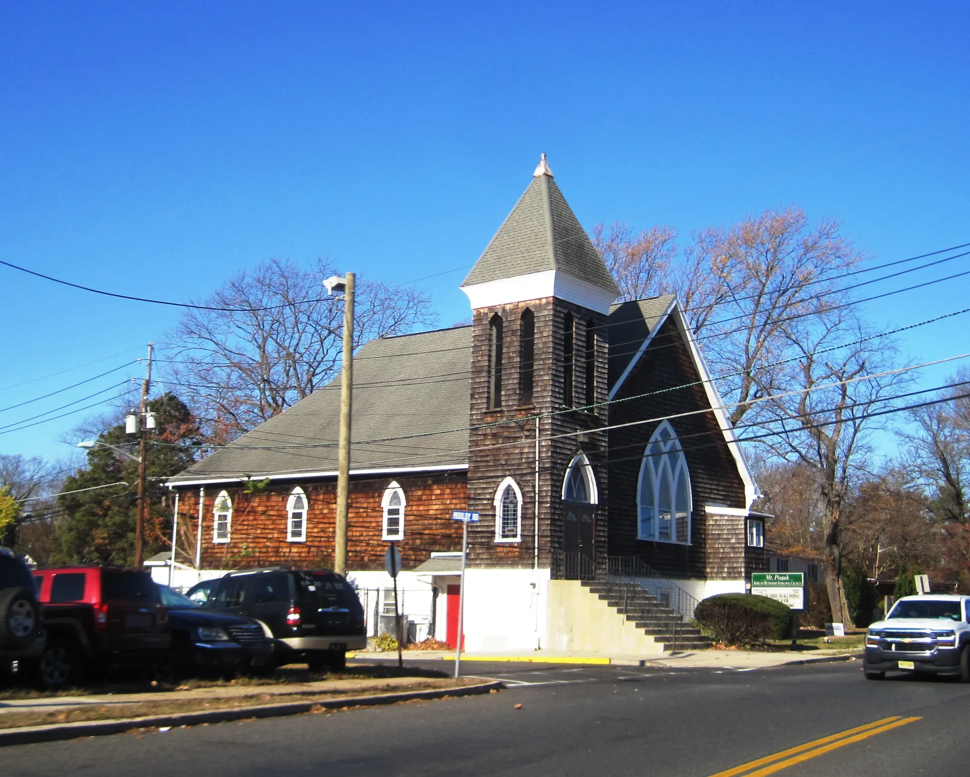 Mt. Pisgah AME Church in Lawnside is a red brick church with a pointed gable tower and a red front door.