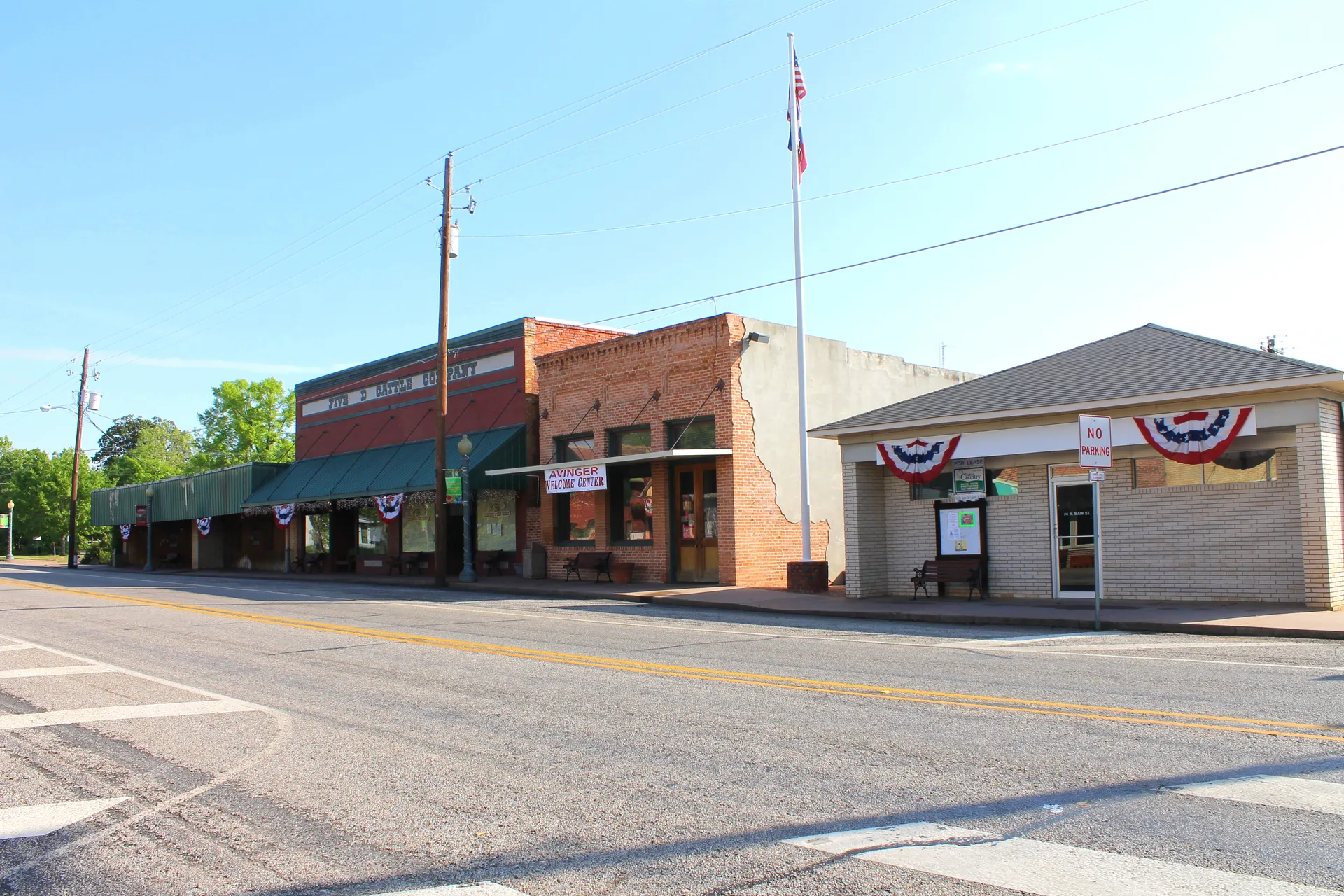 Historic storefronts along the main street in Avinger, Texas.