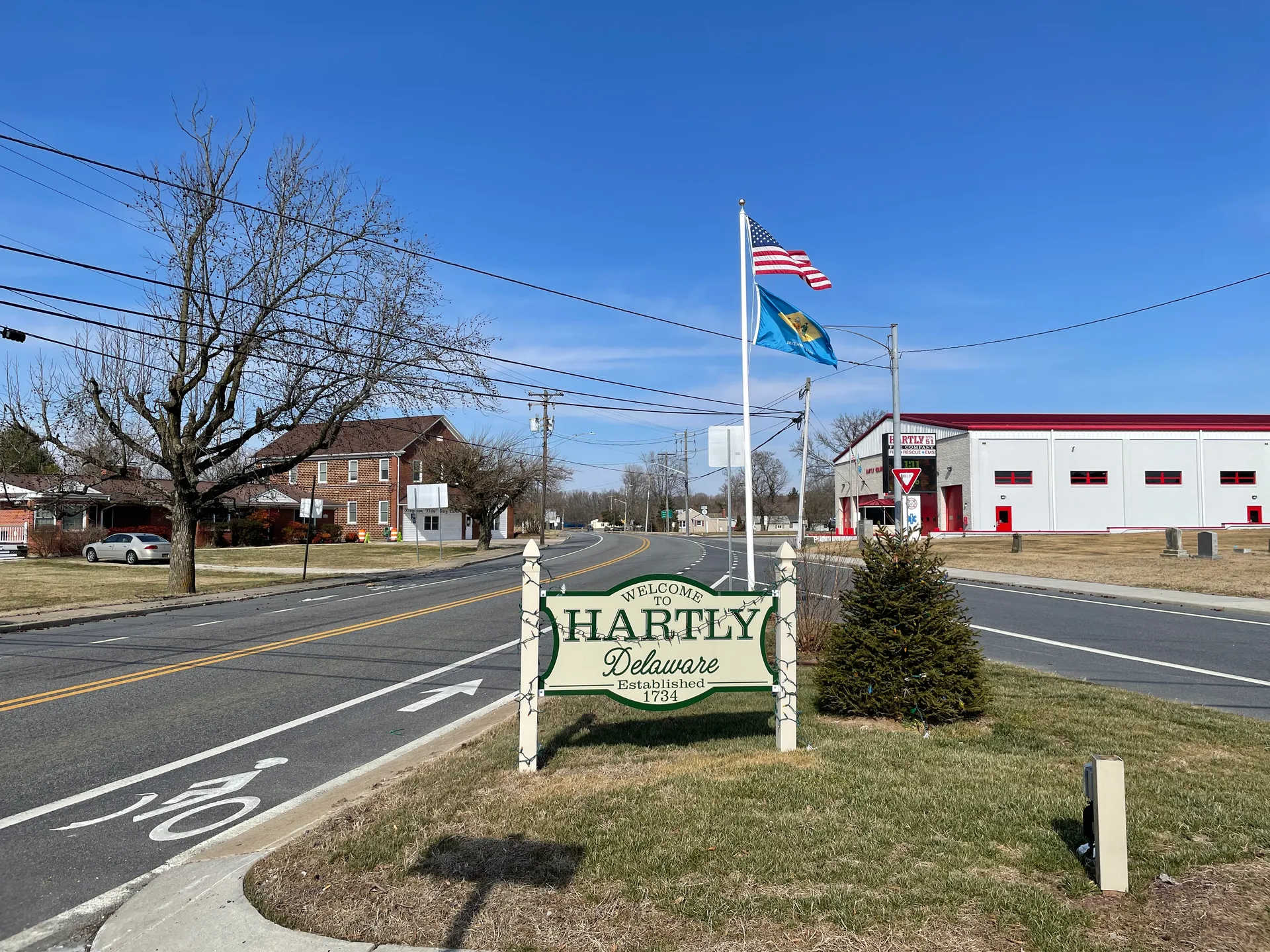 Hartly town sign and flagpole in Hartly, Delaware.