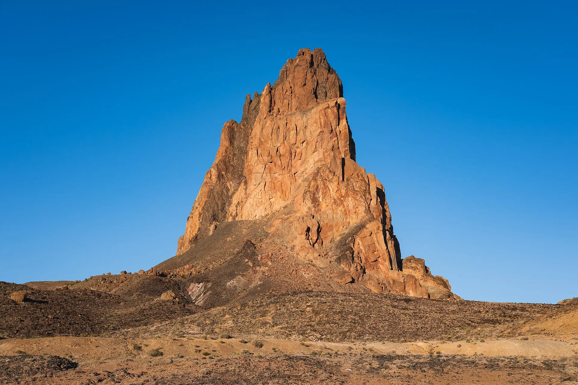 Agathla Peak (El Capitan), a volcanic plug in the Navajo Nation, lit by low evening sun, Arizona, USA.
