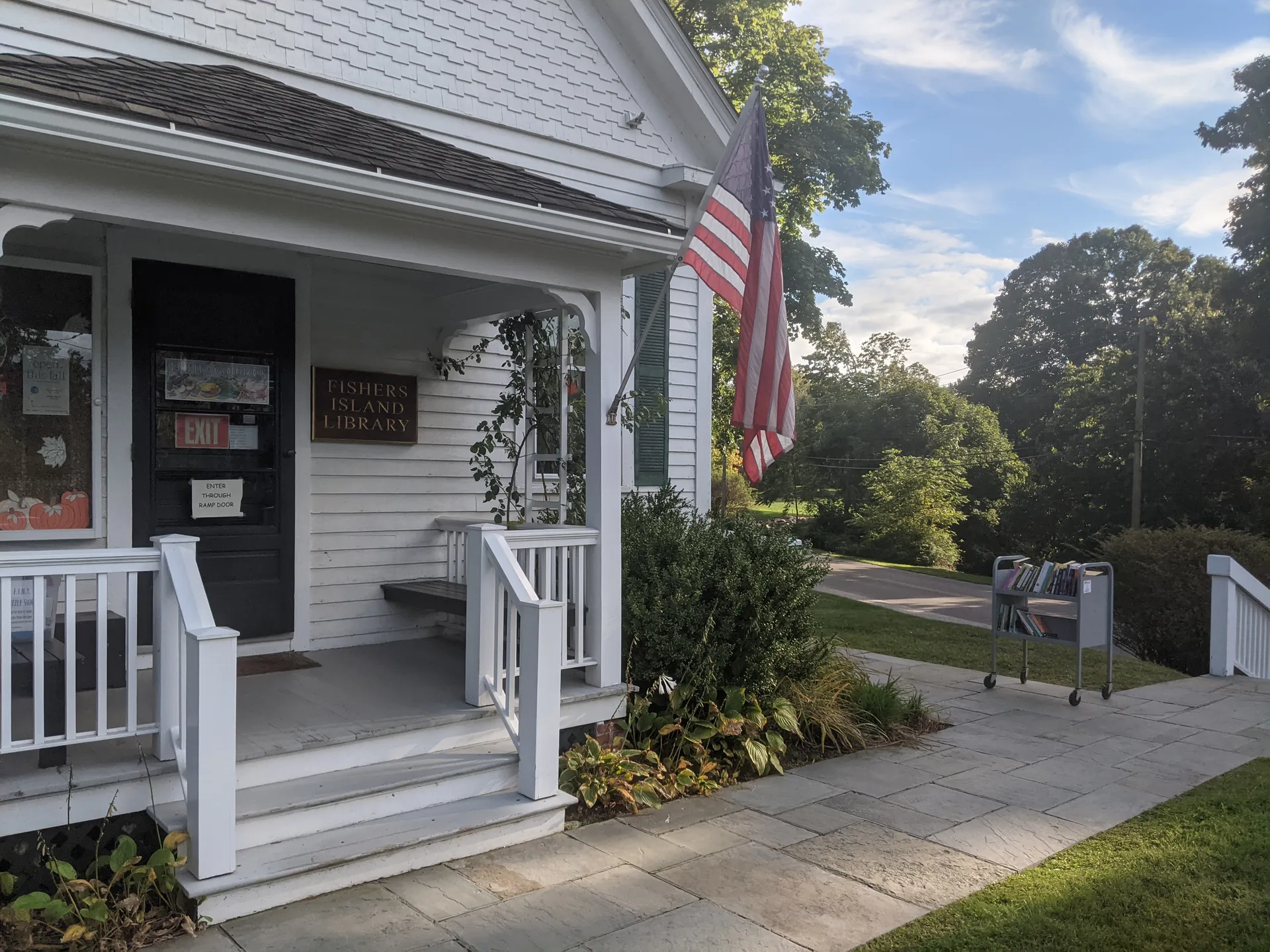 Fishers Island Library porch with a flag on Fishers Island, New York.