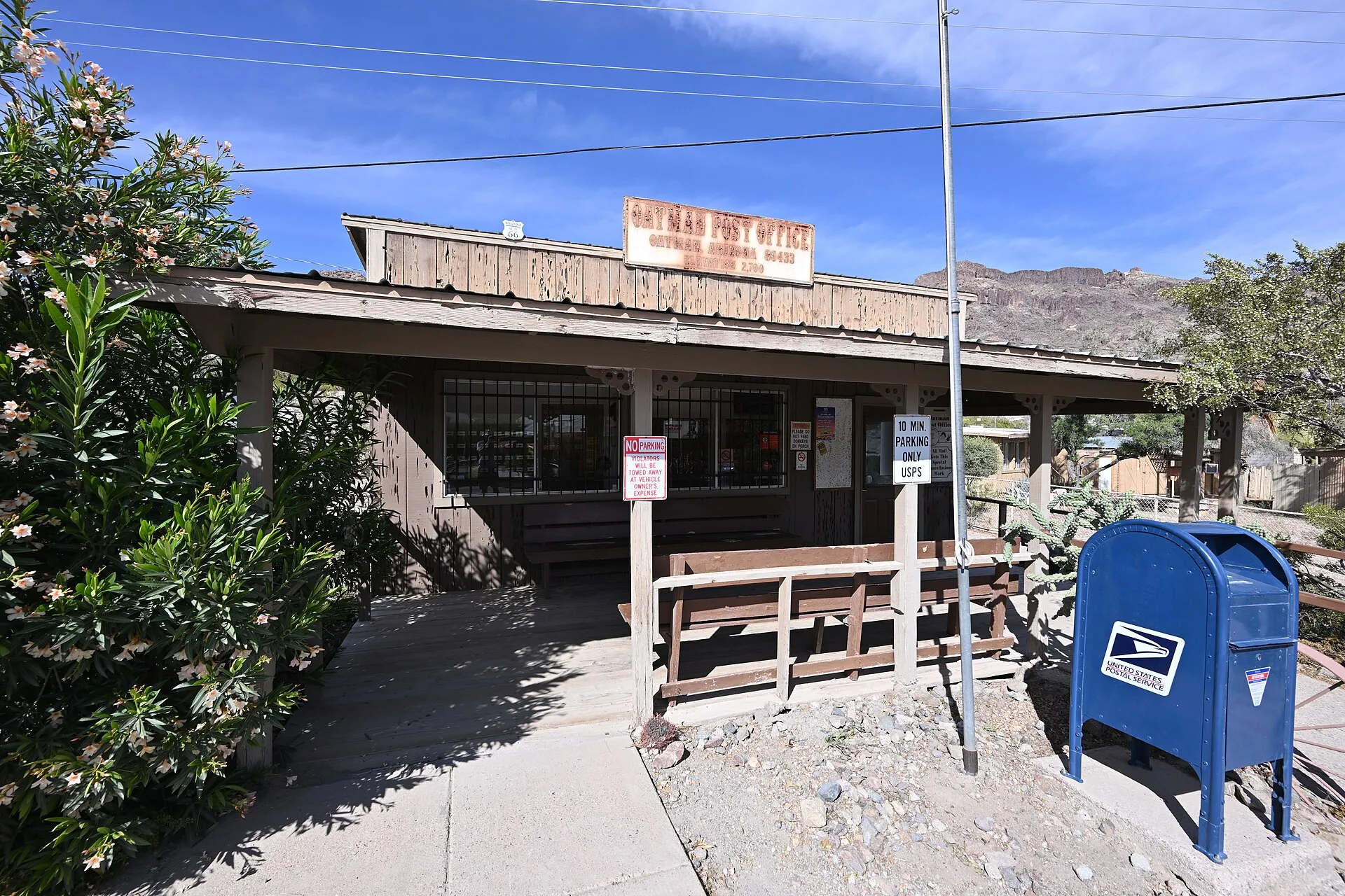 The sign may be faded, but this is an active post office with a blue mailbox out front. 251 Main Street, Oatman, Arizona 86433.
