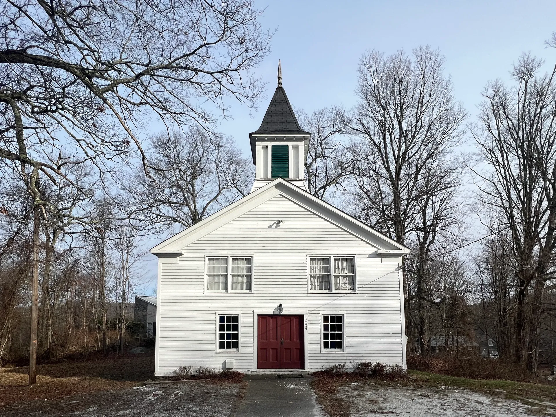 White Whaley Lake Church with a small steeple in Pawling, New York.