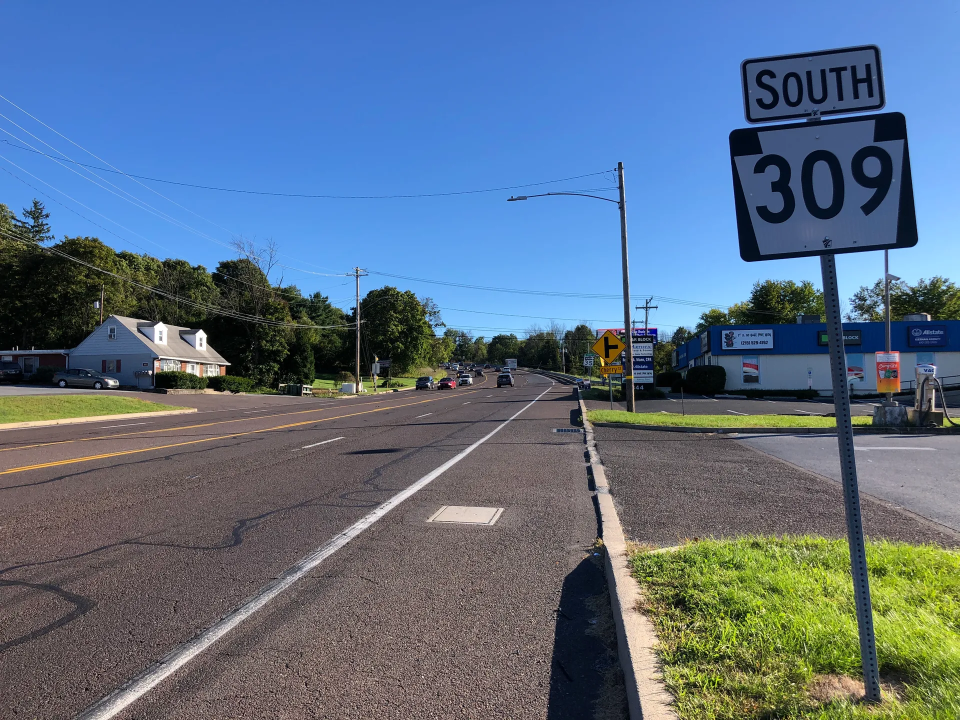 Third Street (Route 309) runs south through Coopersburg past Charles Street, with homes and businesses along wide sidewalks.