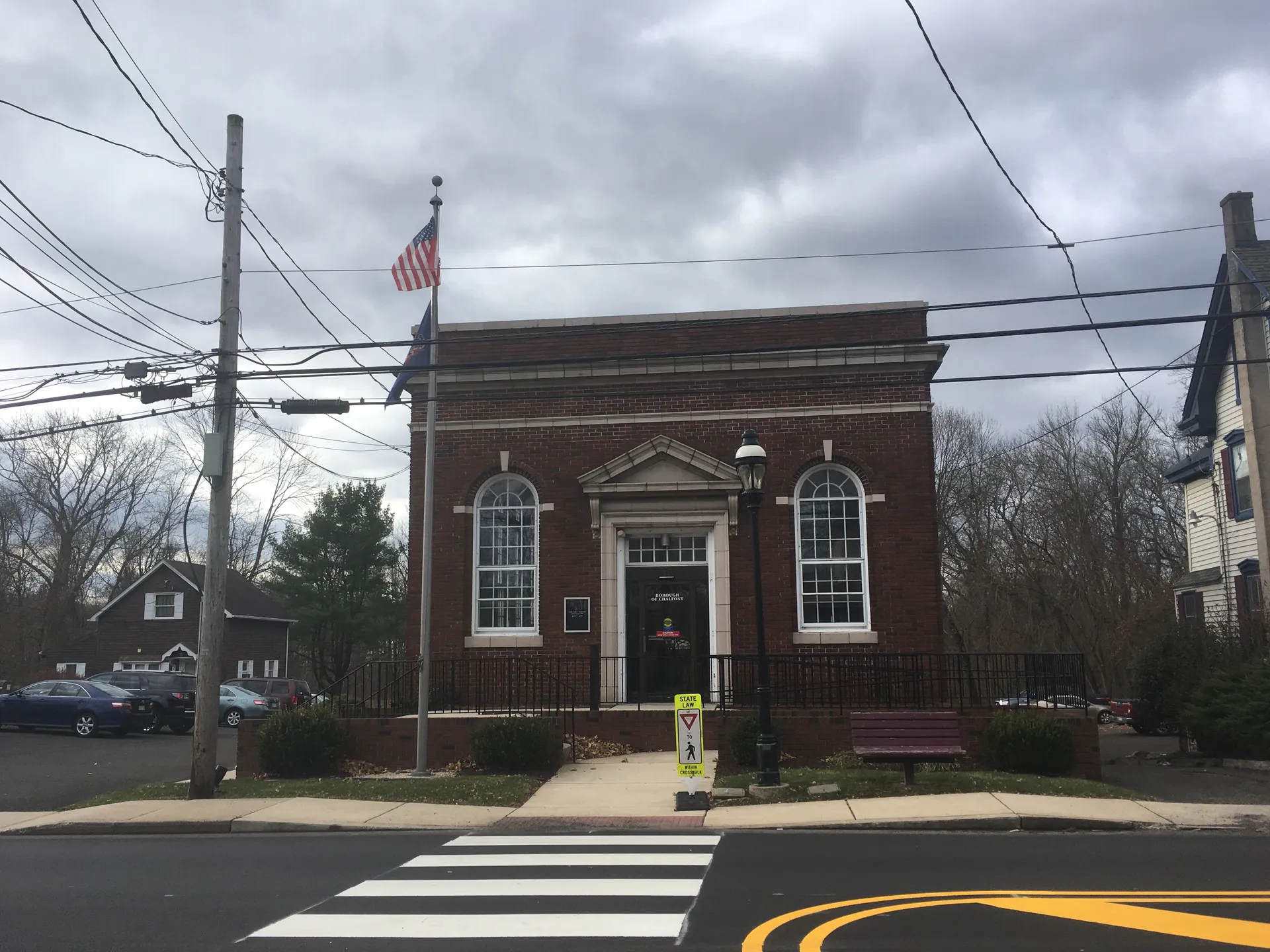 Chalfont's borough hall is a dignified red-brick building with arched windows and a flag flying beside the entrance.
