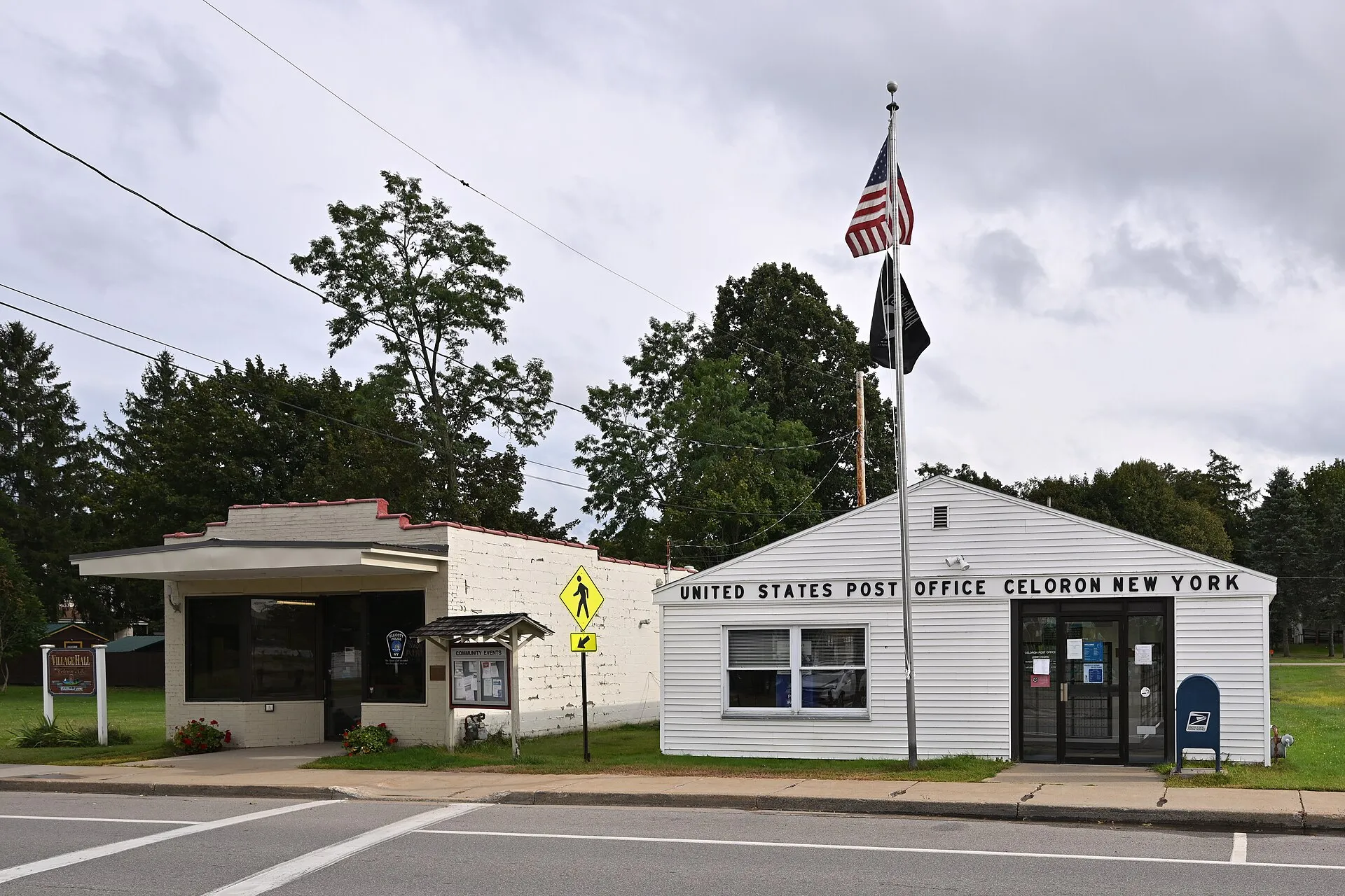 Celoron village post office building with a flag in Celoron, New York.