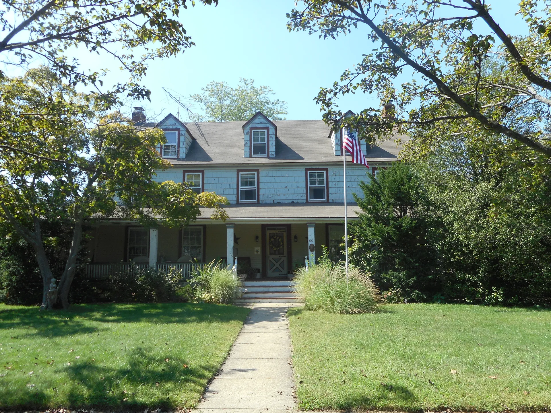 Historic Denton Homestead with a front walkway in East Rockaway, New York.