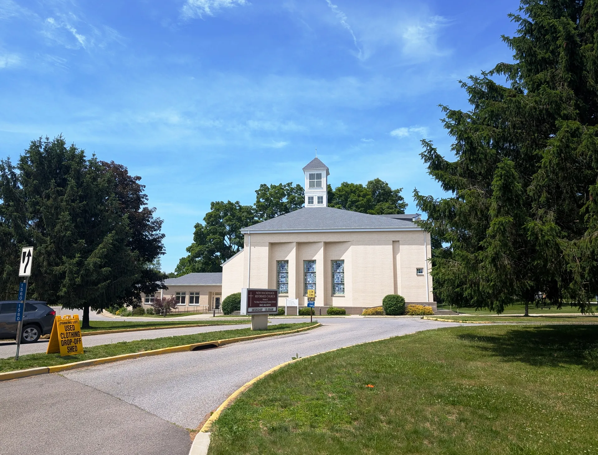 White New Hackensack Reformed Church with a cupola in New Hackensack, New York.