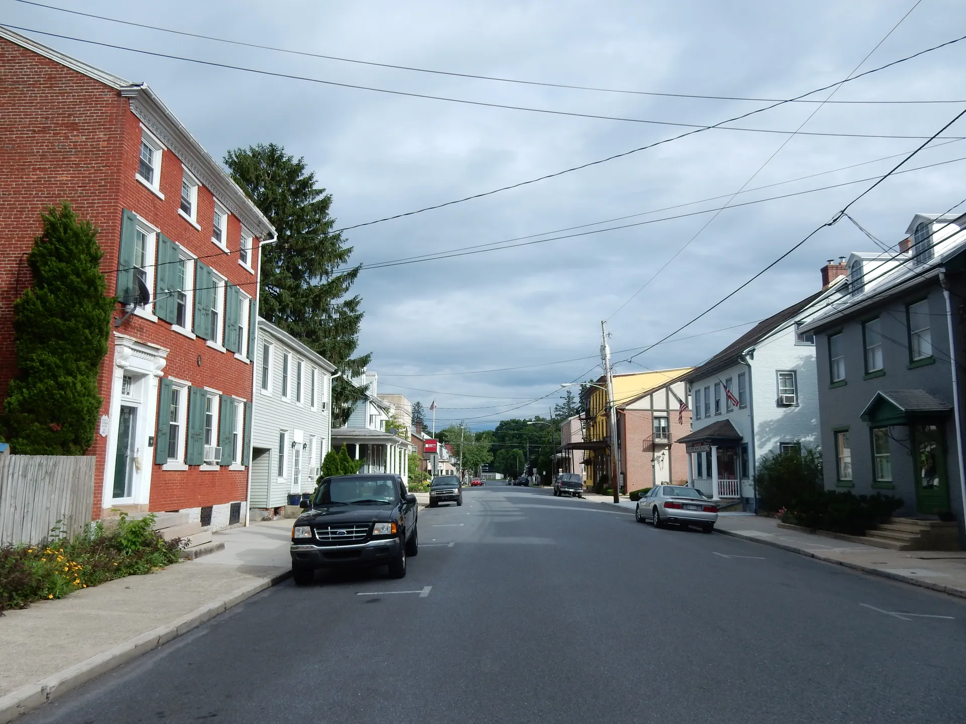 Brick rowhouses with dormers and small porches line Main Street in Bernville, a borough in northern Berks County.