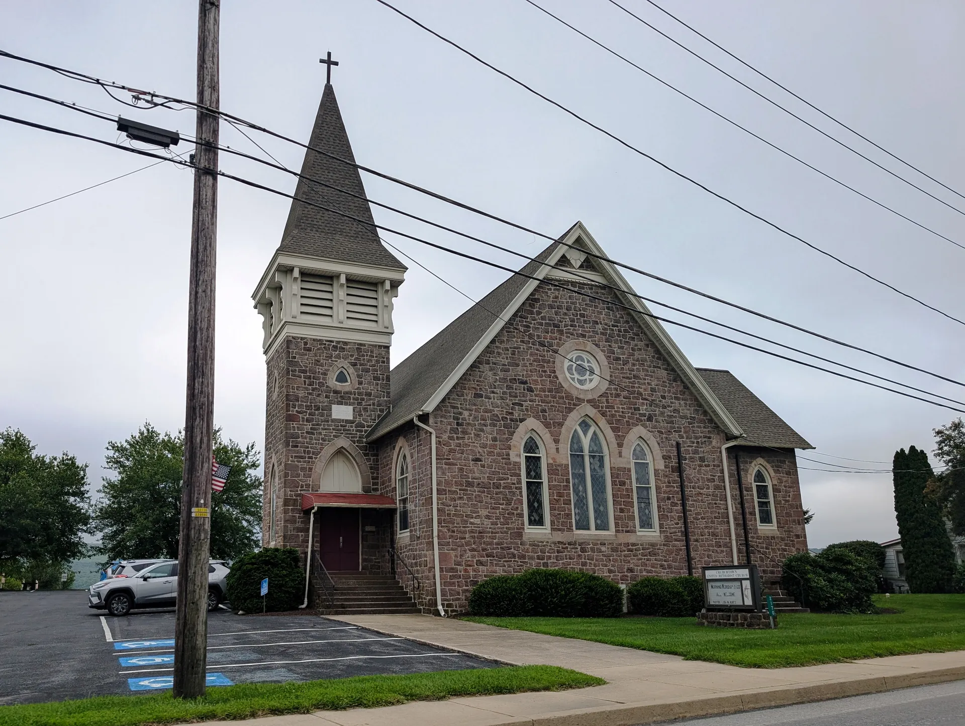 Churchtown United Methodist Church is a fieldstone church with a square tower and tall arched windows on Main Street.