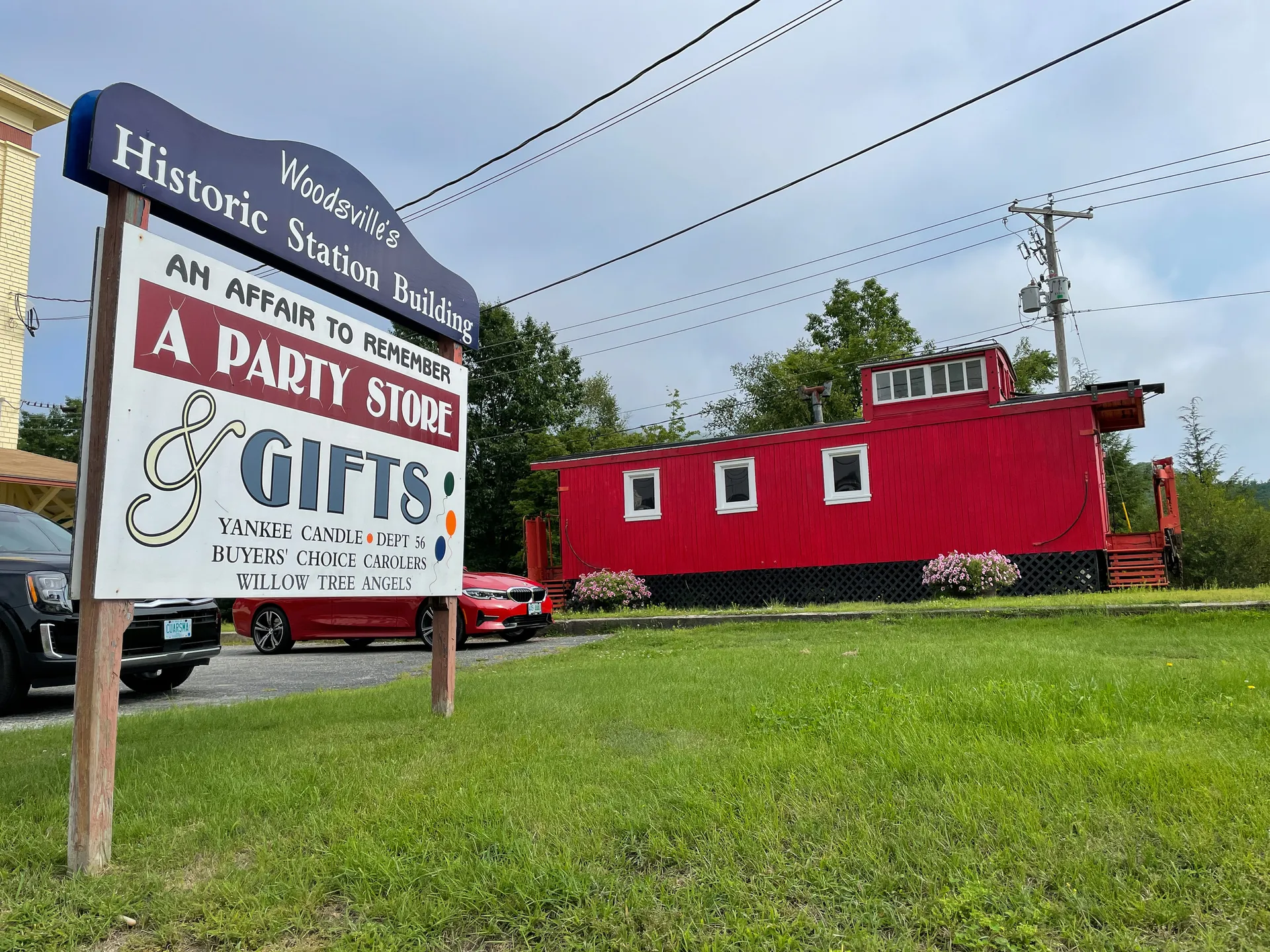 Historic Woodsville train station and red caboose in Woodsville, New Hampshire.