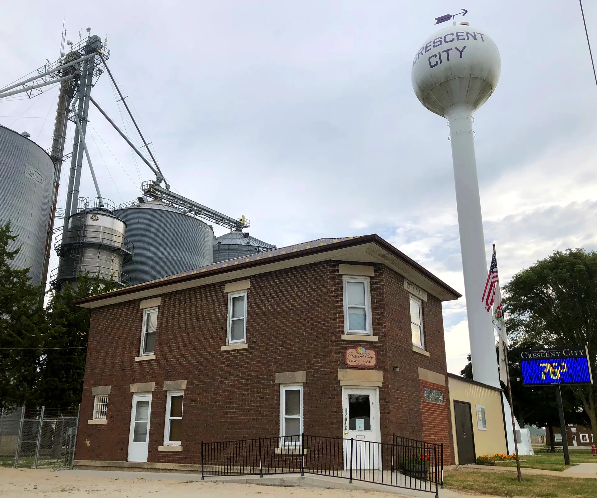 Historic brick town hall and water tower in Crescent City, Illinois.