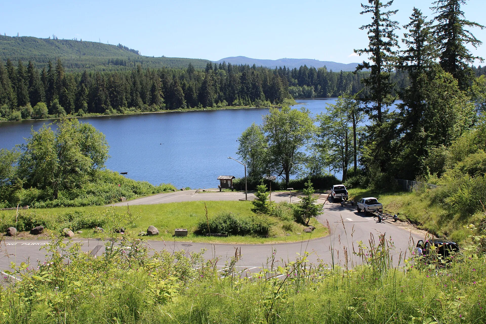 Lake Kapowsin surrounded by forest in Kapowsin, Washington.