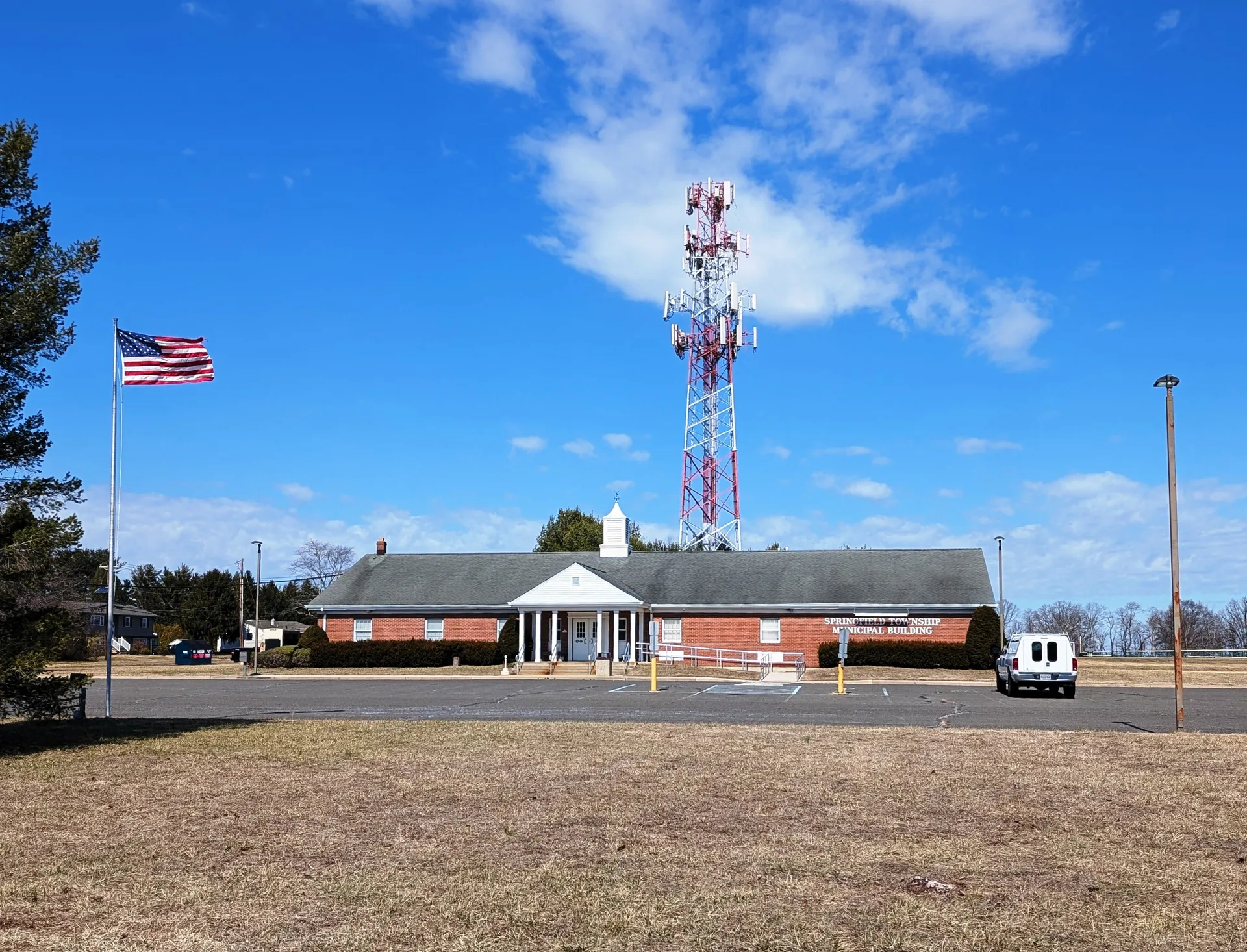 The Springfield Township municipal building in Jobstown is a long brick colonial with white trim on a wide lot.