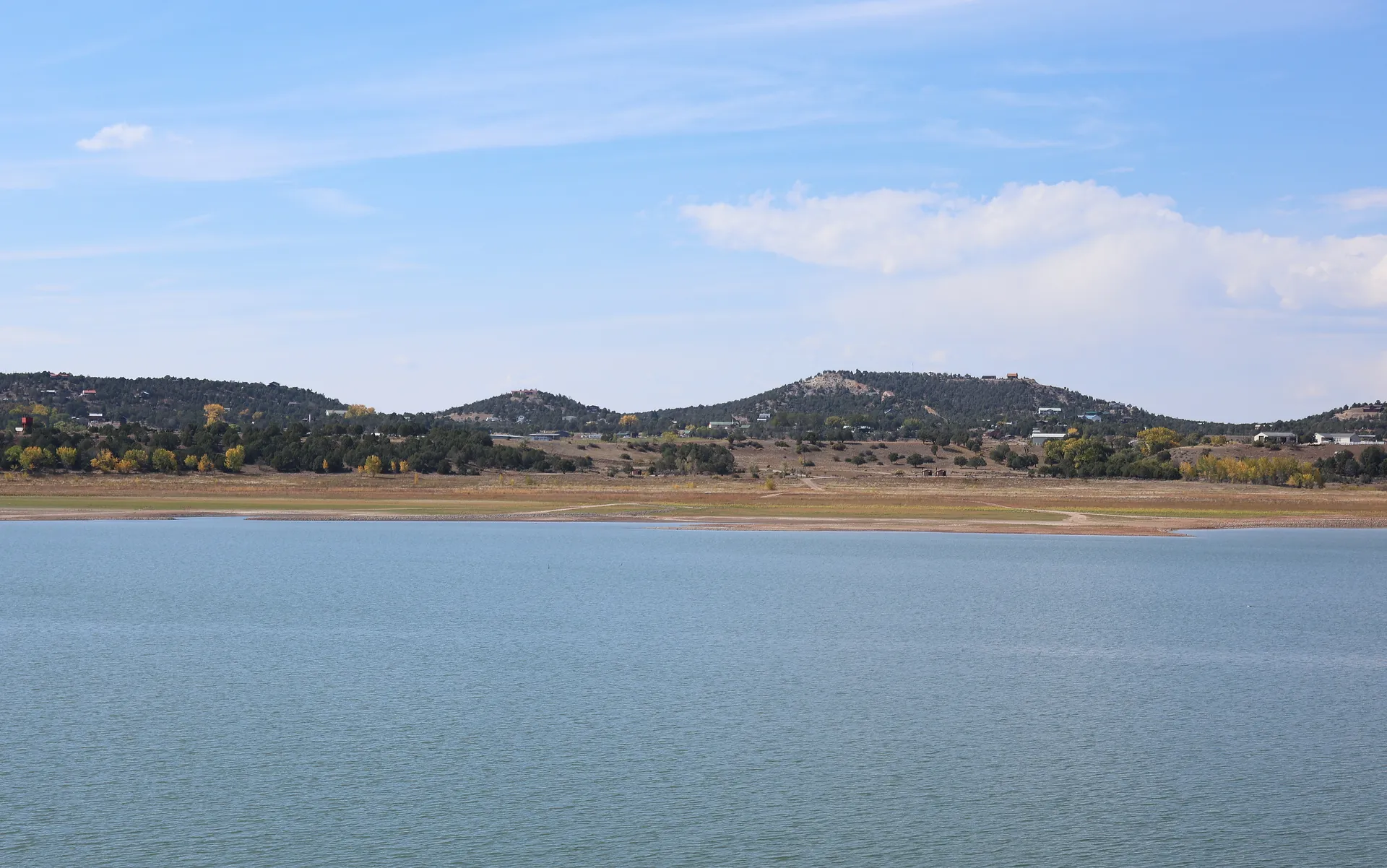 Calm lake and forested hills near Arboles, Colorado.
