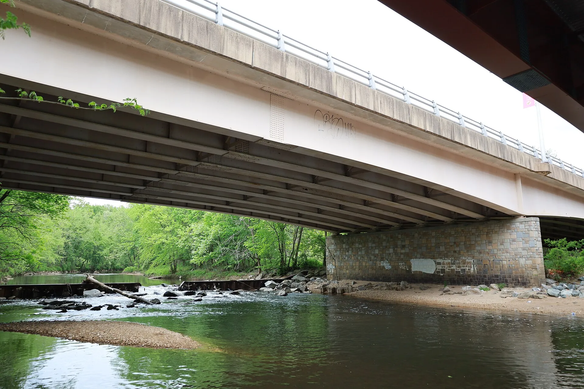 Northeast Branch river under the River Road bridge in Riverdale Park, Maryland.