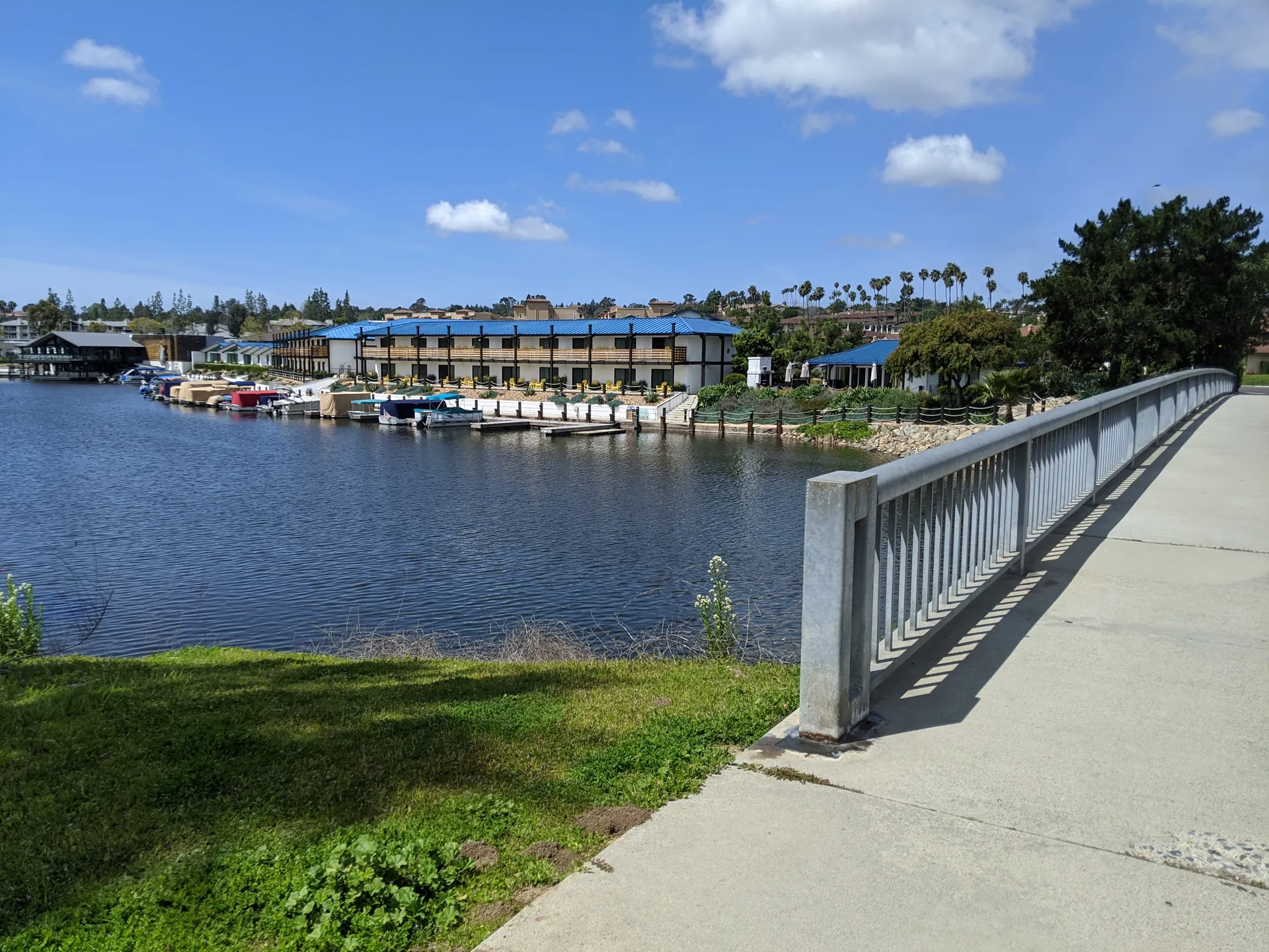 Waterfront homes and boats seen from a bridge at Lake San Marcos, California.
