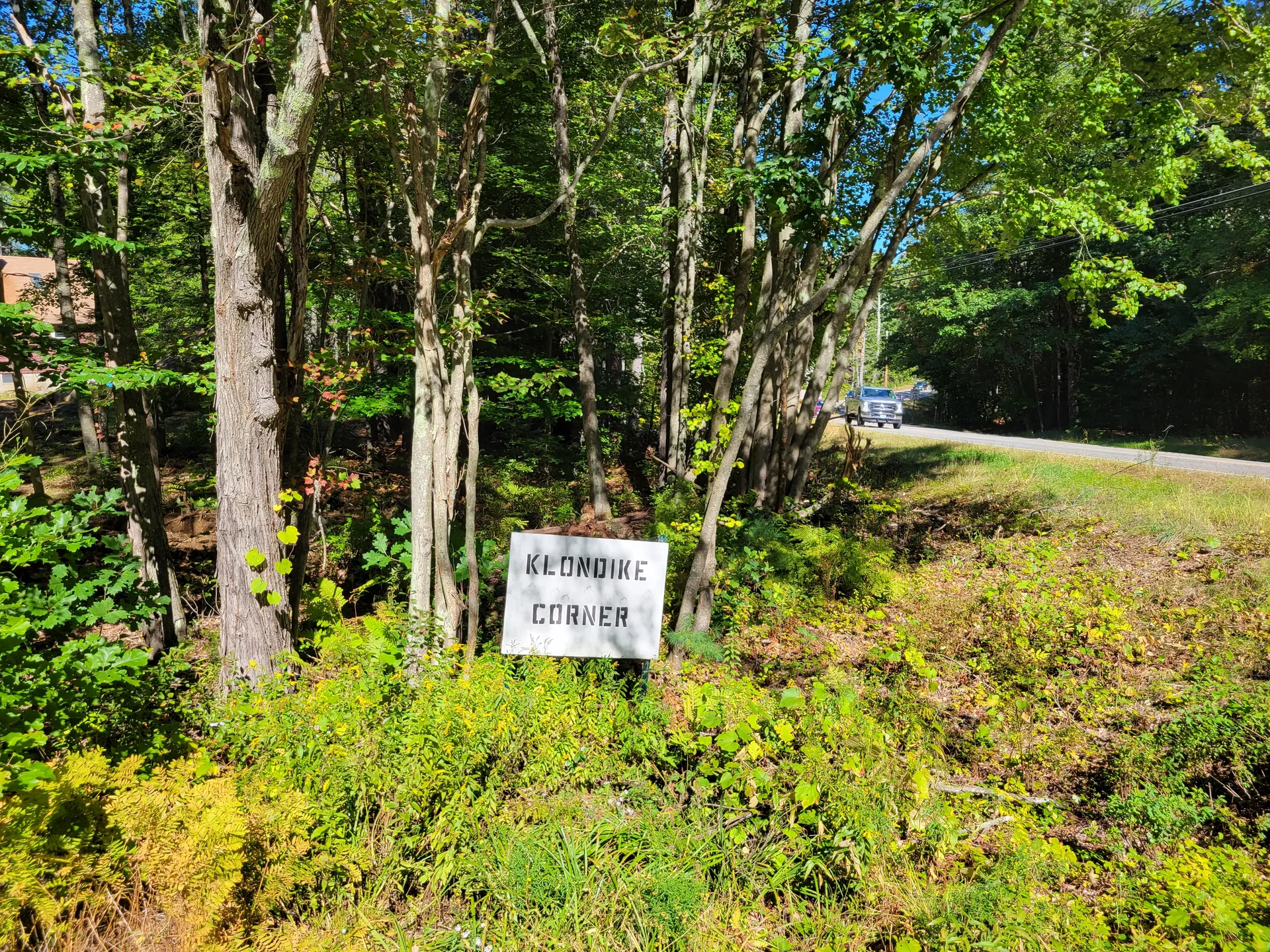 Klondike Corner sign in the woods in New Boston, New Hampshire.