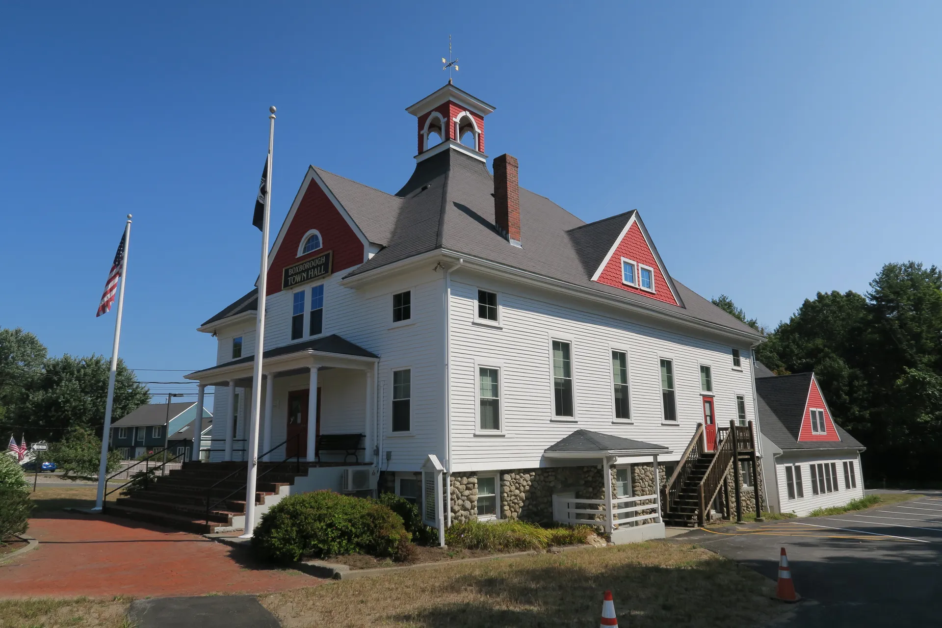Historic Boxborough Town Hall with white clapboard in Boxborough, Massachusetts.
