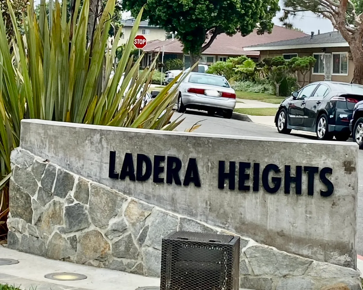 A Ladera Heights neighborhood sign beside a residential street in Los Angeles County, California.