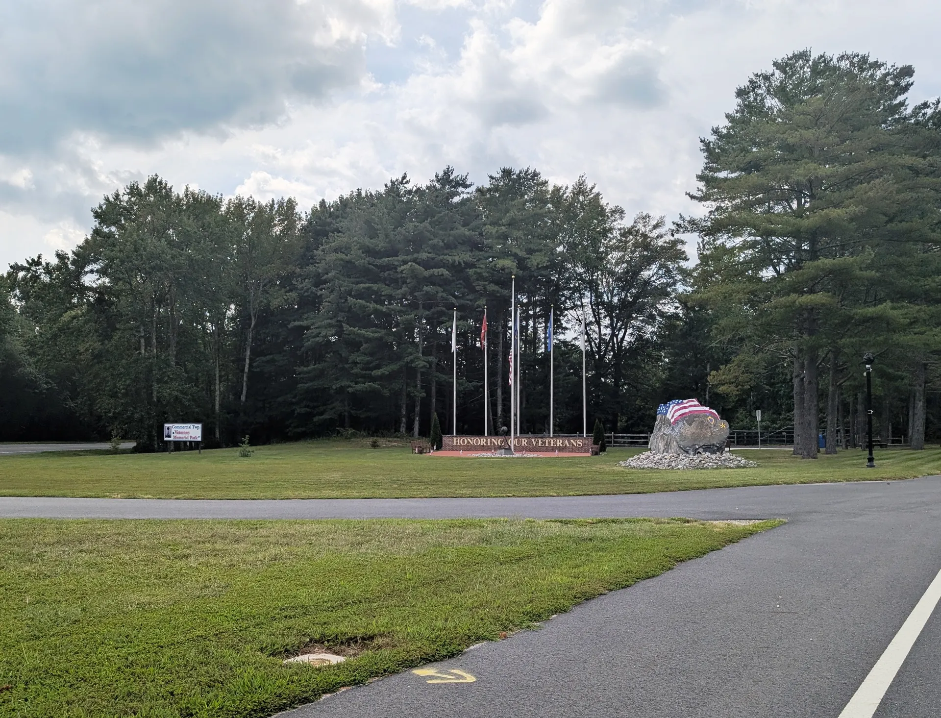 The Commercial Township Veterans Memorial in Mauricetown is a grassy plaza with flagpoles and a monument.