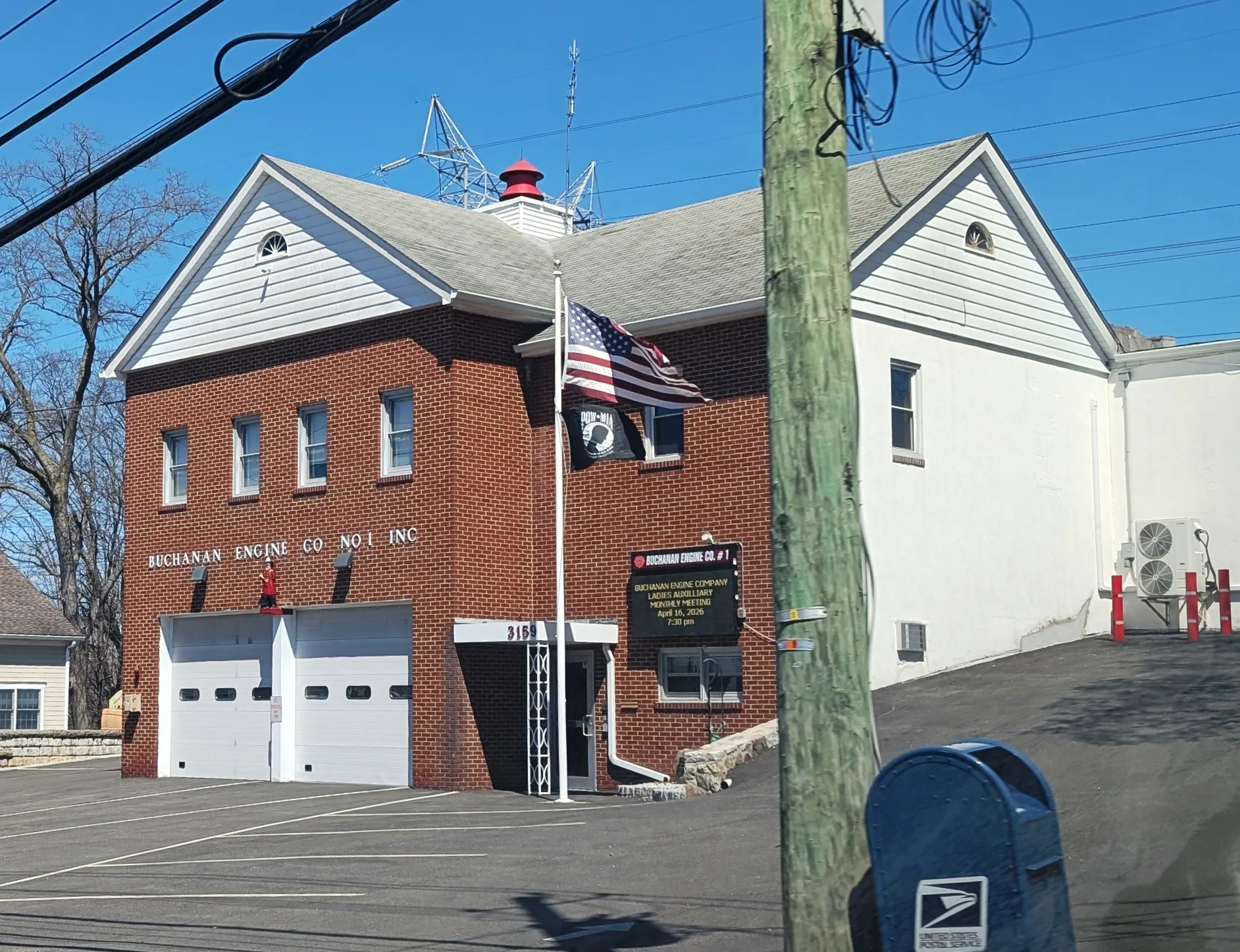 Brick Buchanan Engine Company No. 1 firehouse with a flag in Buchanan, New York.