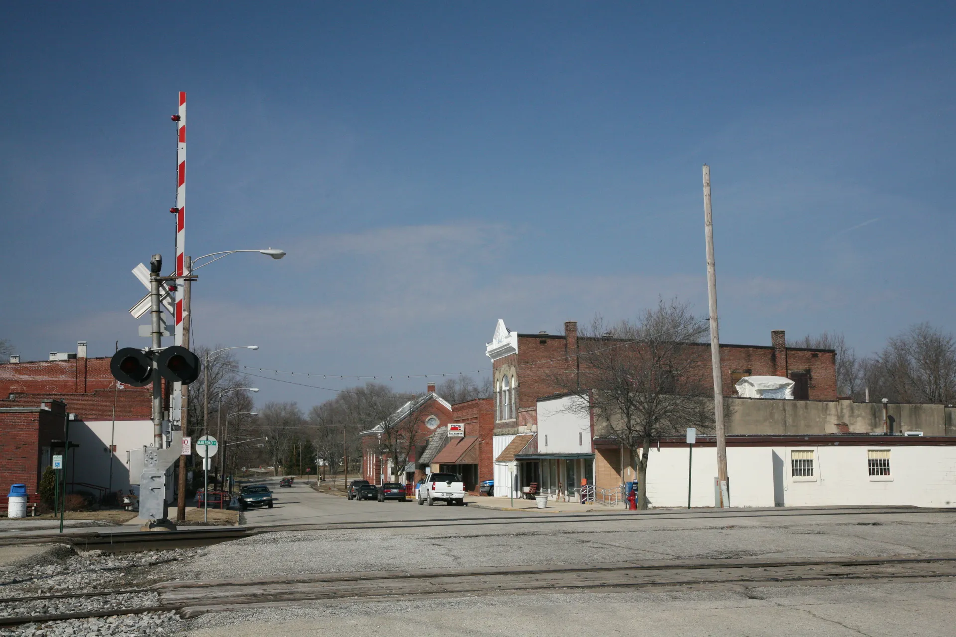 Downtown street with brick buildings in Sidney, Illinois.