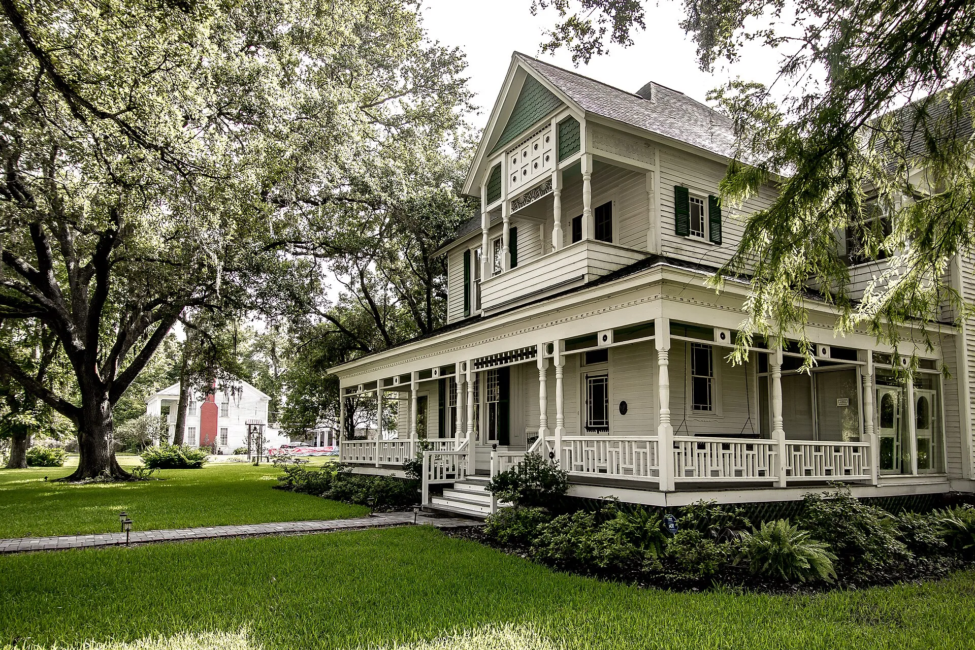 Historic Victorian house with wraparound porch in East Columbia, Texas.