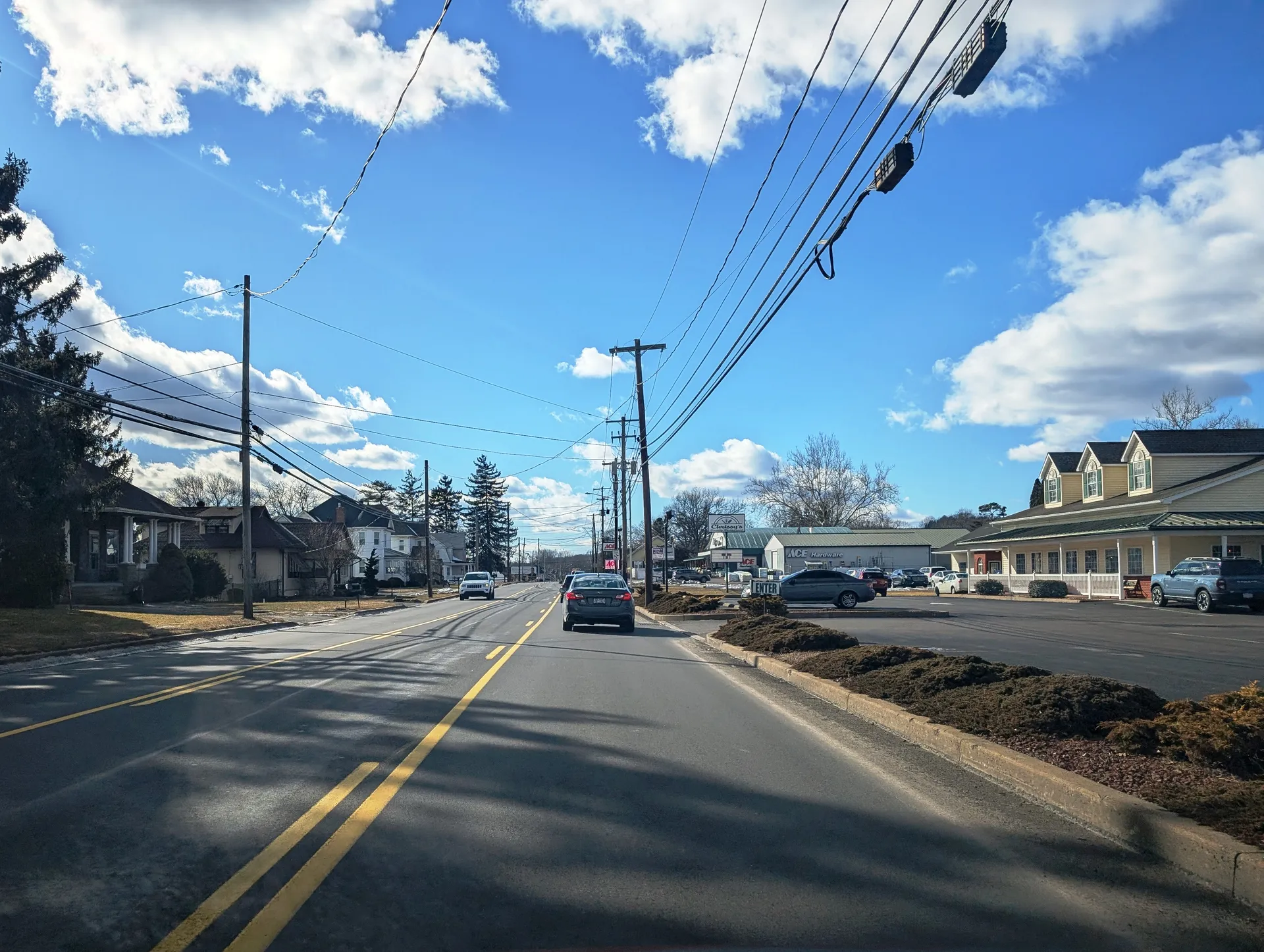 West Front Street (U.S. Route 11) in Briar Creek borough passes homes, shops and utility lines between Welliver Road and Briana Way.