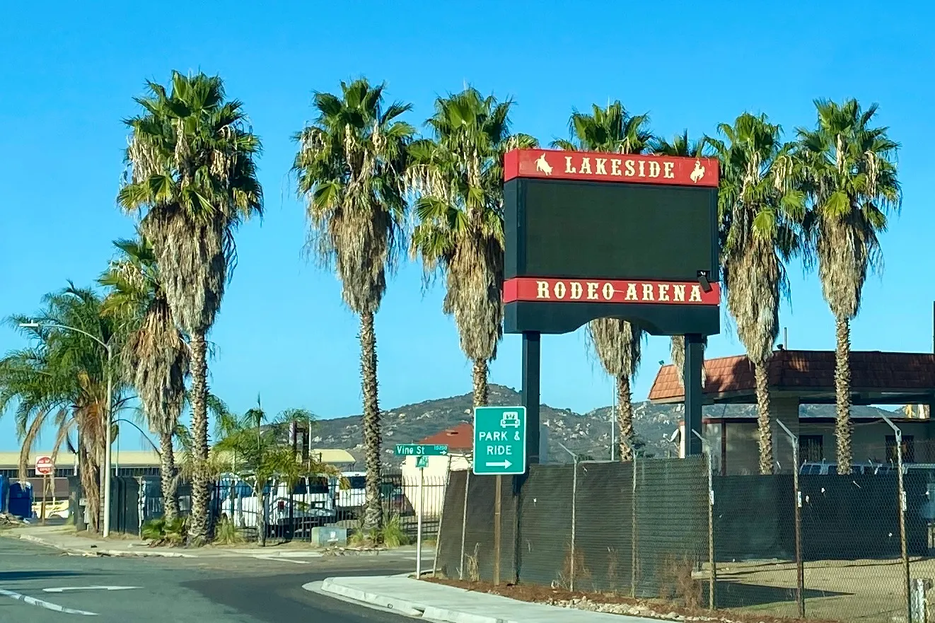 Palm-lined entrance sign of the Lakeside Rodeo Arena in Lakeside, San Diego County, California.
