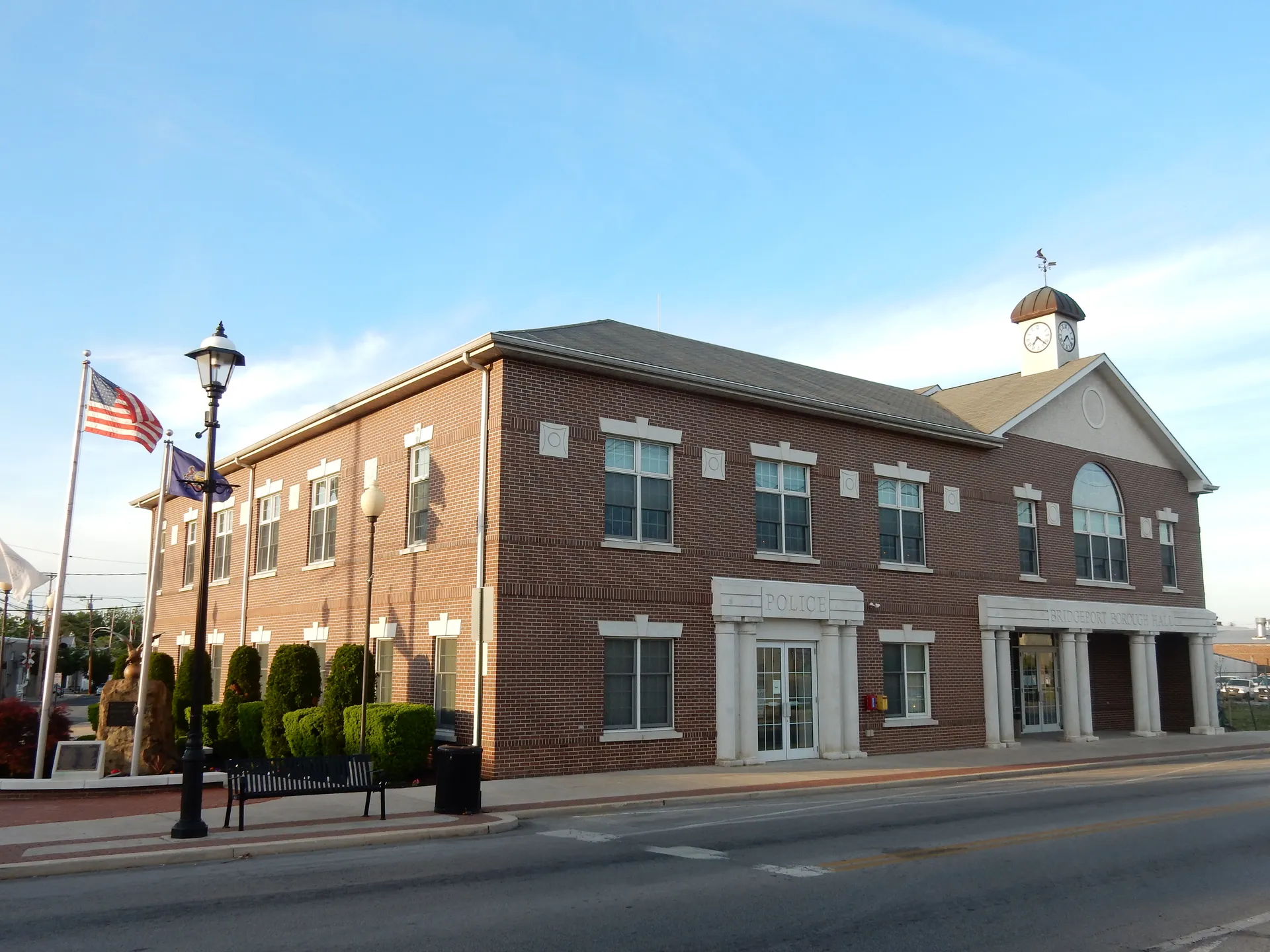 Bridgeport's three-story brick Borough Hall and Police Department building stands at 65 West 4th Street with white-trimmed entrances.