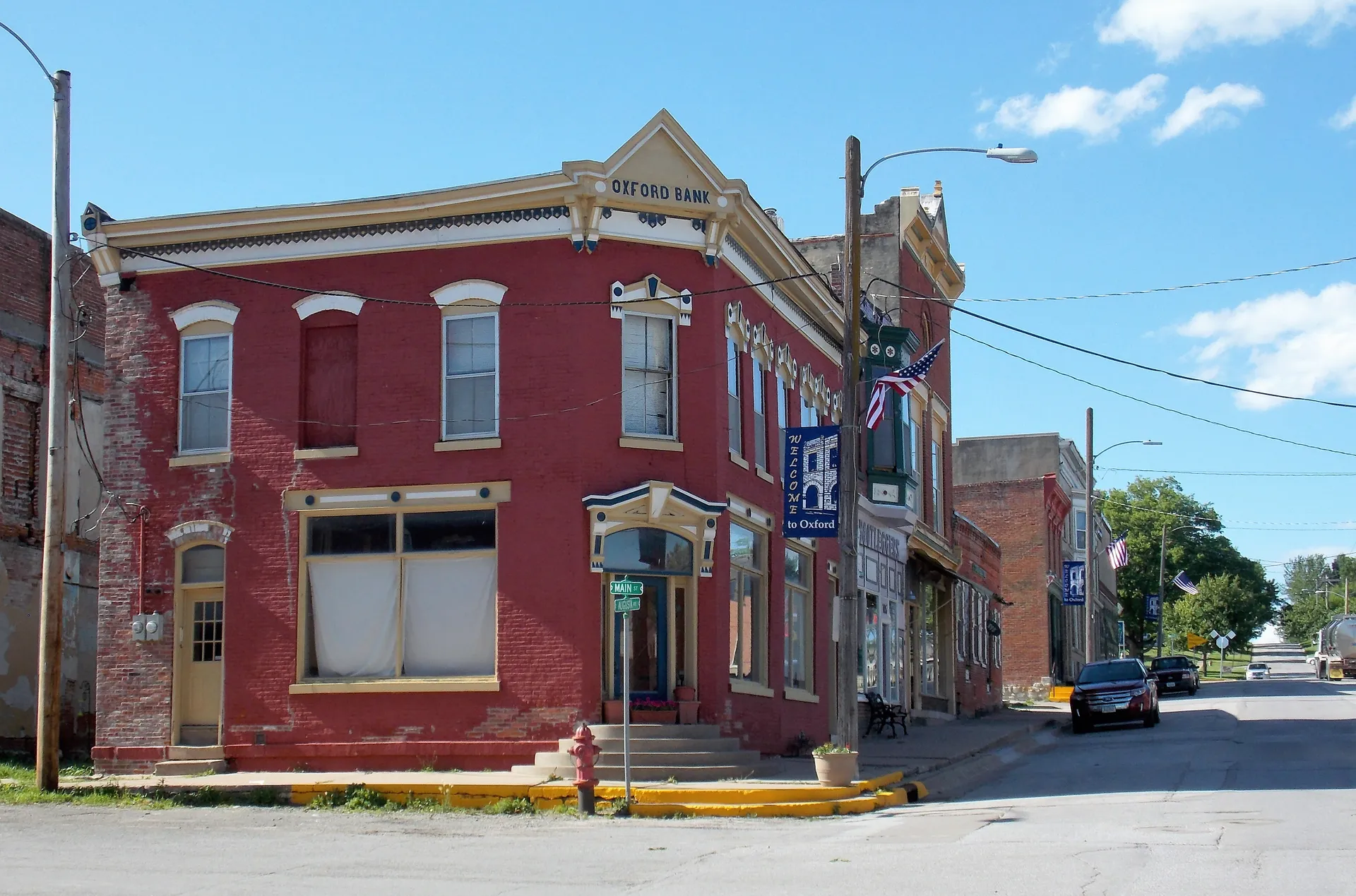 Historic red brick building on a street in Oxford, Iowa.