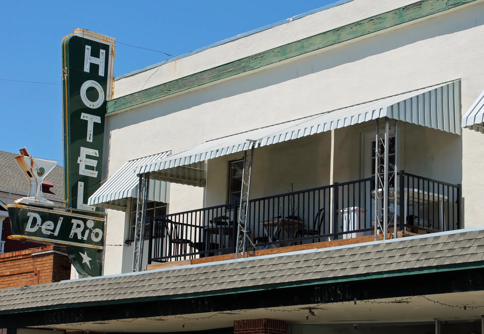 The upper facade and balcony of Hotel del Rio in Isleton, California.
