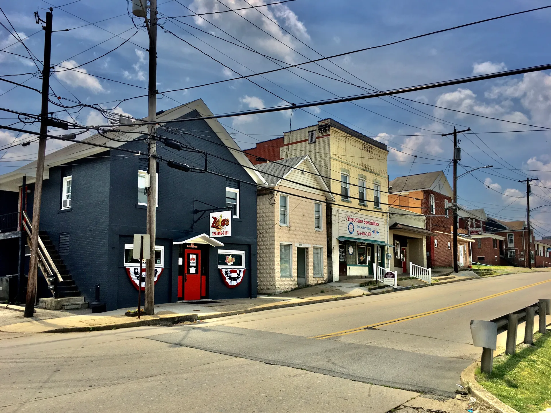 Brightly painted storefronts and older homes meet at Sewickley Avenue and 3rd Street in the hamlet of Herminie.