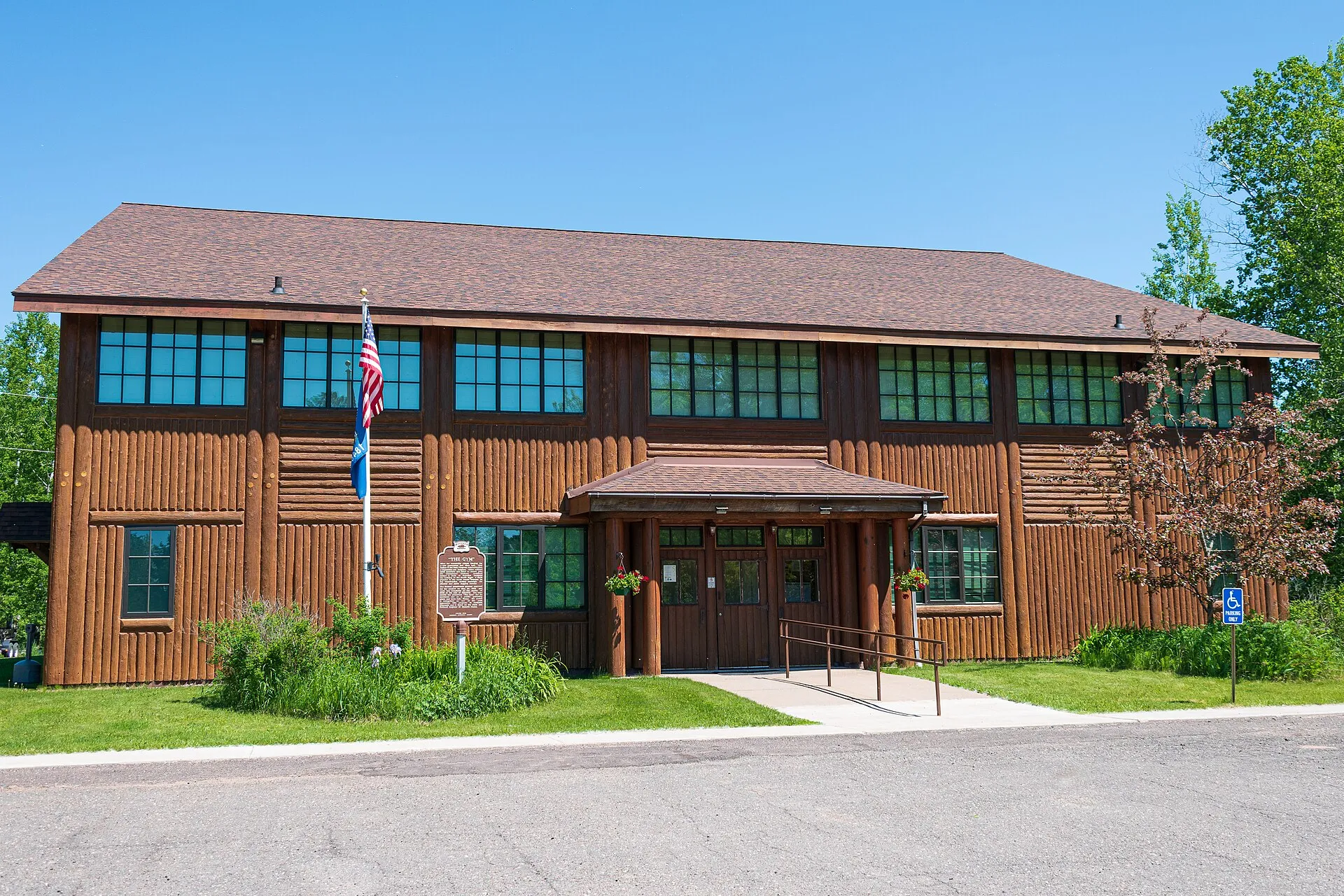 Herbster Community Center, a brick building with green lawn in Herbster, Wisconsin.