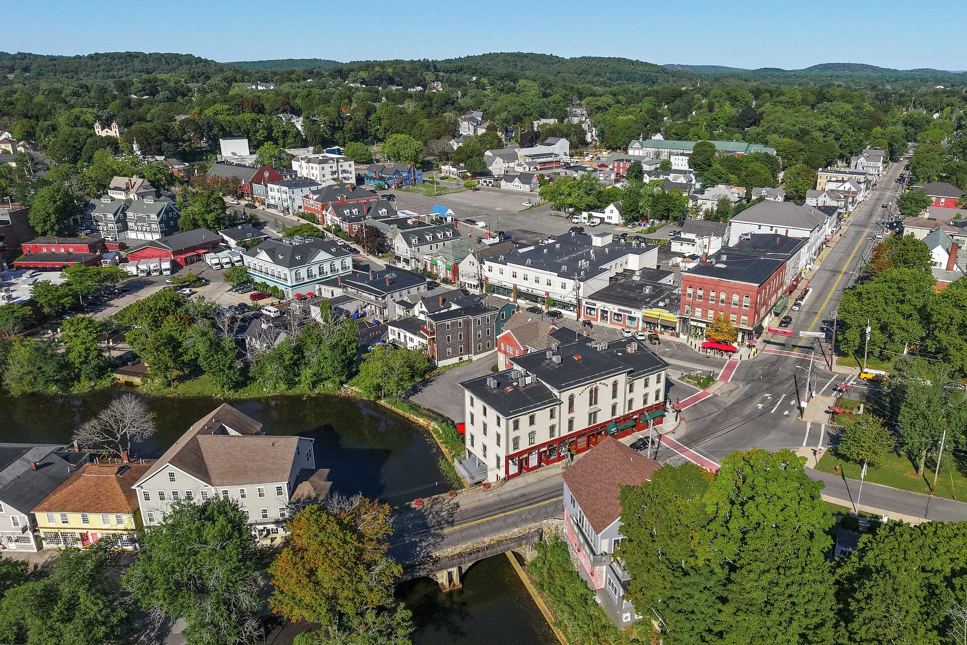 Aerial view of historic Ipswich, Massachusetts, among autumn trees.