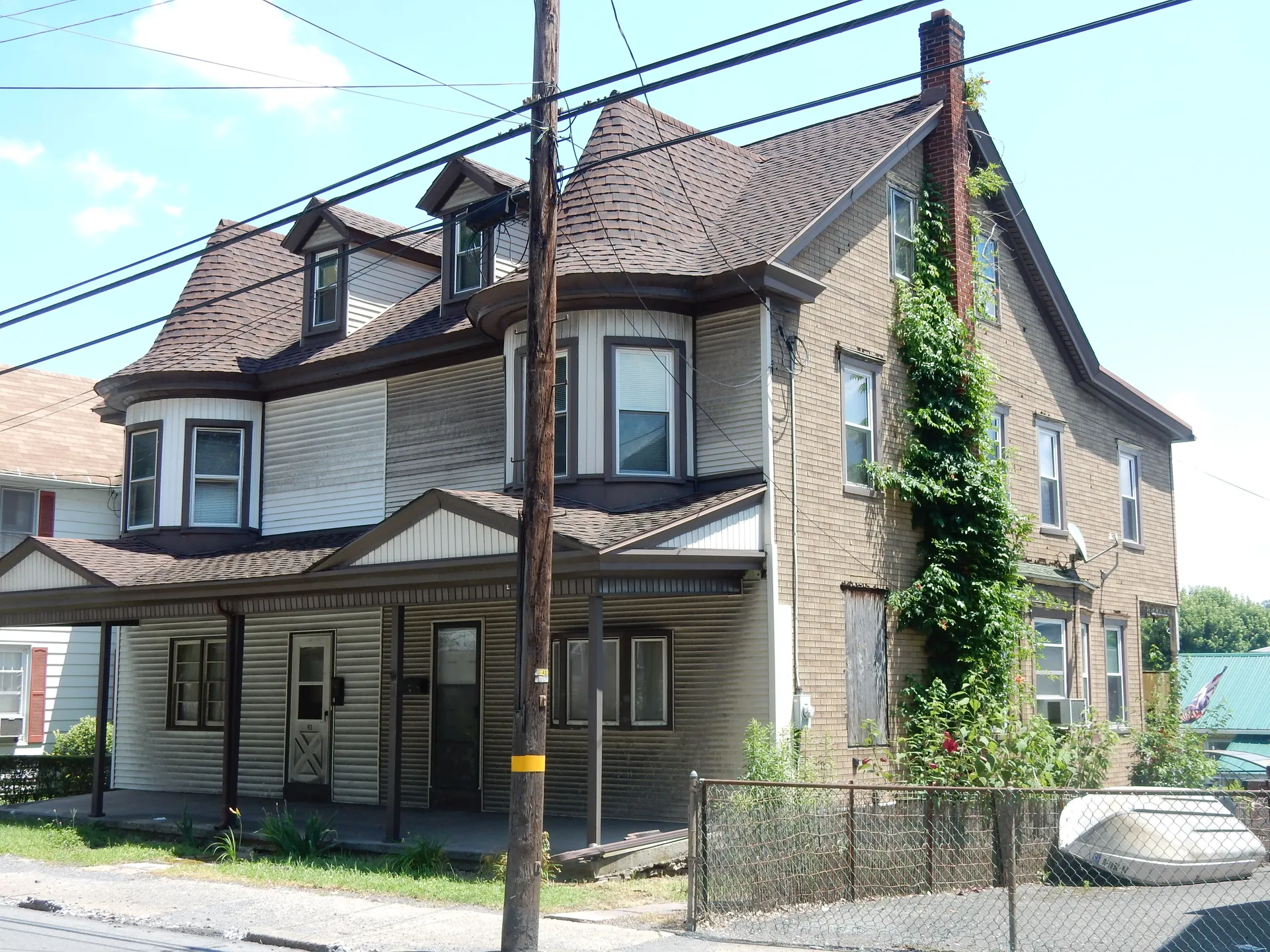 A tall frame house with a gabled roof, porches and ivy-covered walls stands on Pottsville Street in Cressona.