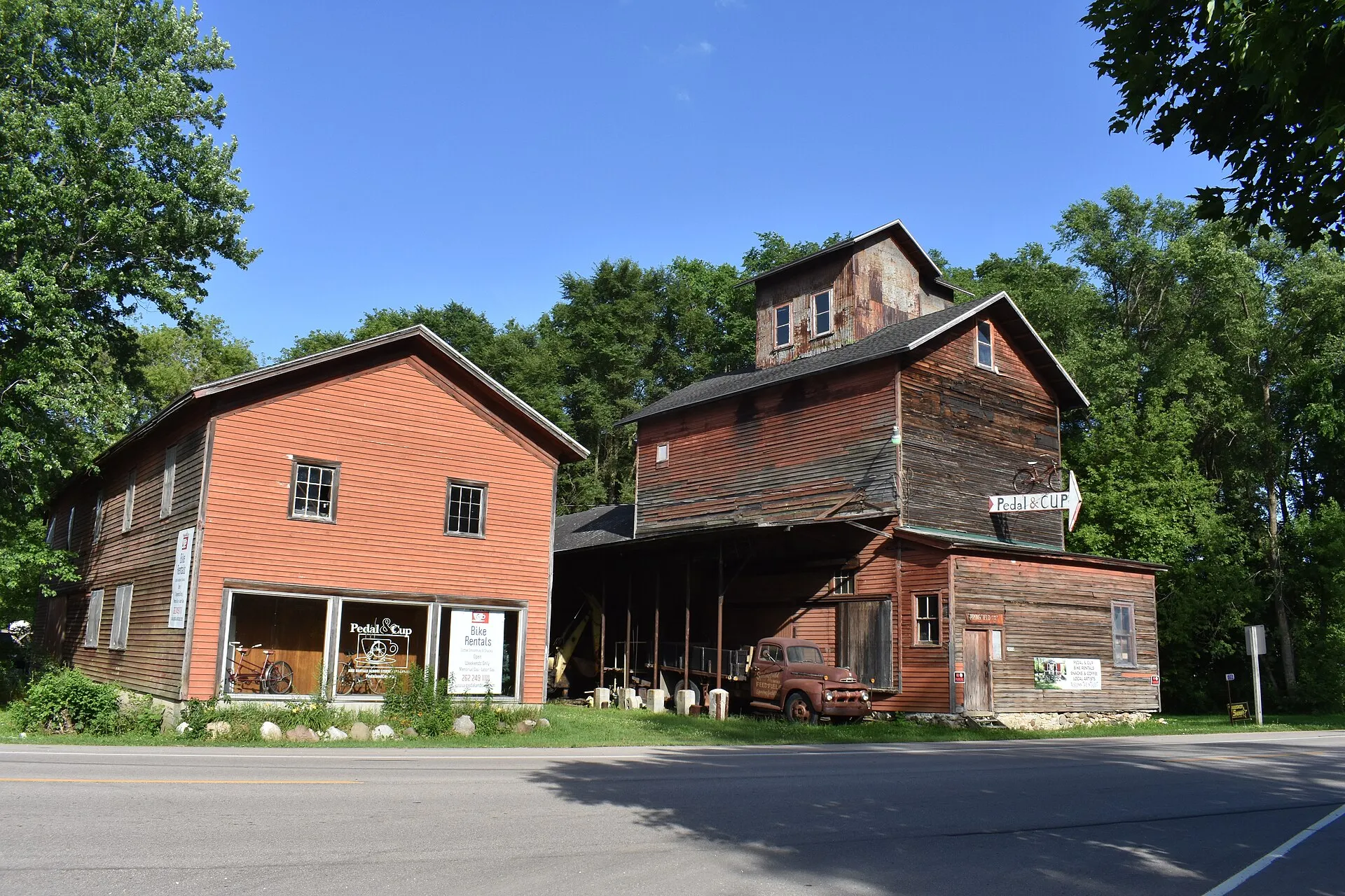 Historic brick buildings among trees in Springfield, Wisconsin.