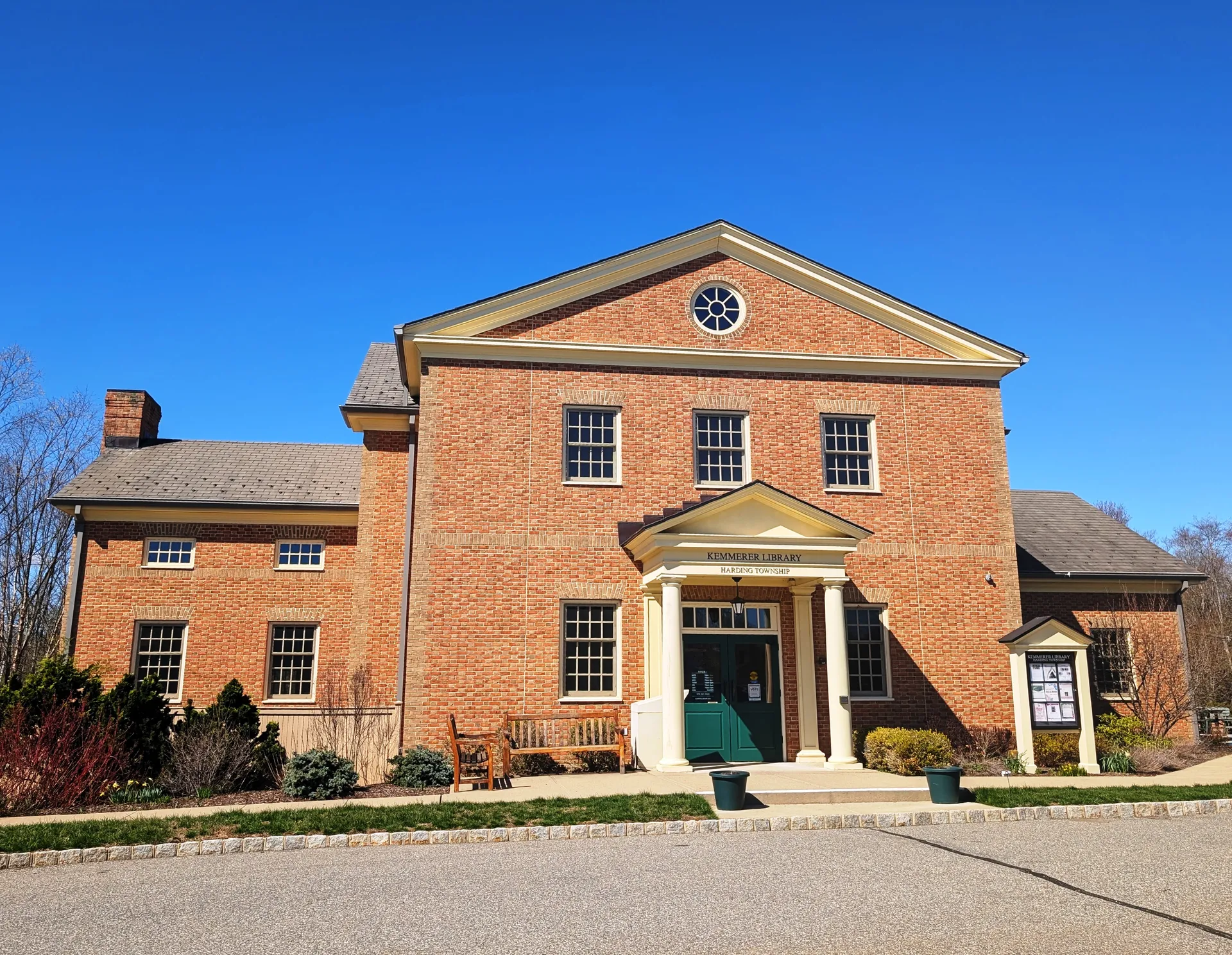 Kemmerer Library in New Vernon is a brick building with a white pedimented entry and arched windows.