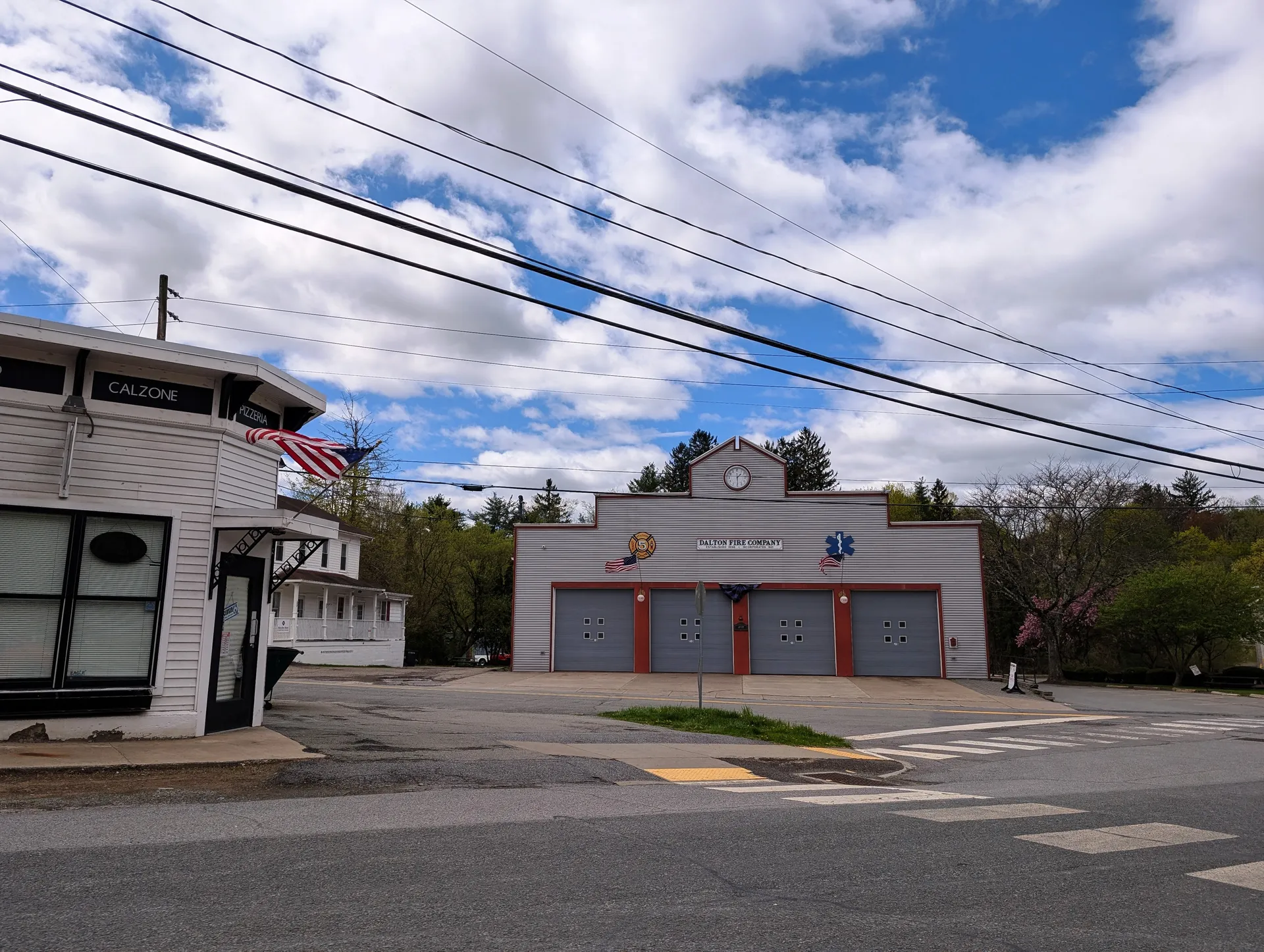 The Dalton Fire Company station features red bay doors and a peaked facade at East Main and Turnpike streets.