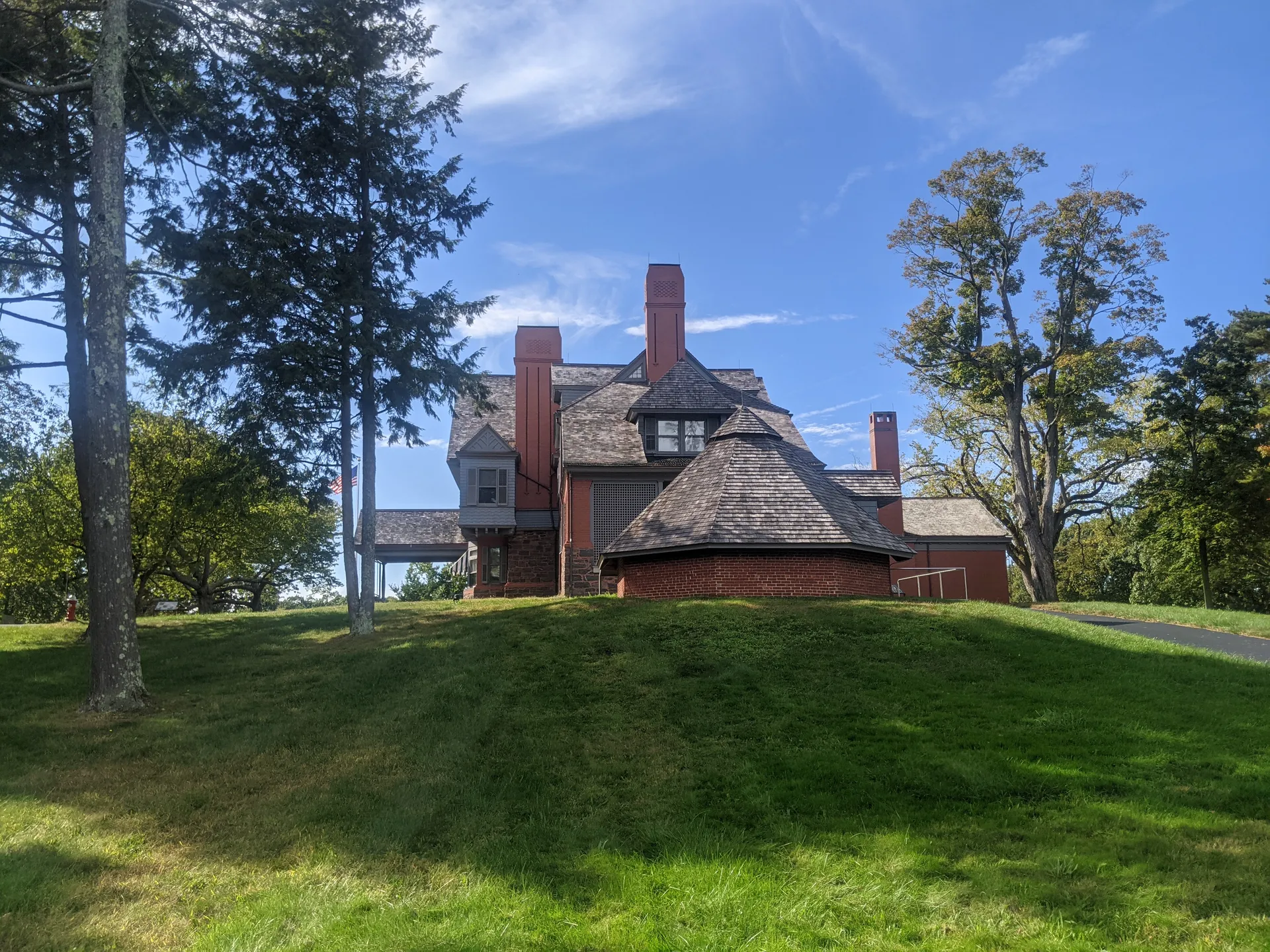 Sagamore Hill, the historic home of Theodore Roosevelt, on a grassy rise in Cove Neck, New York.