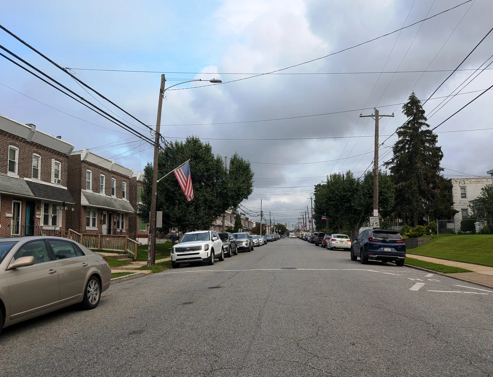 Saville Avenue in Eddystone runs north between East 7th and 9th streets, lined with rowhouses, flags and parked cars.