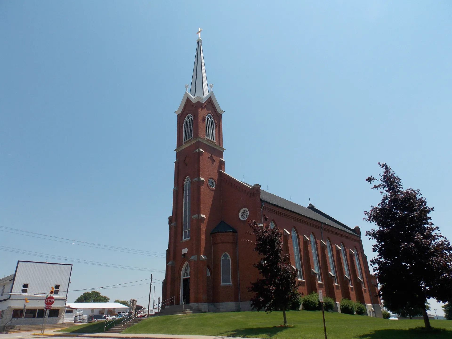 Holy Trinity Church with tall brick spire in Luxemburg, Iowa.