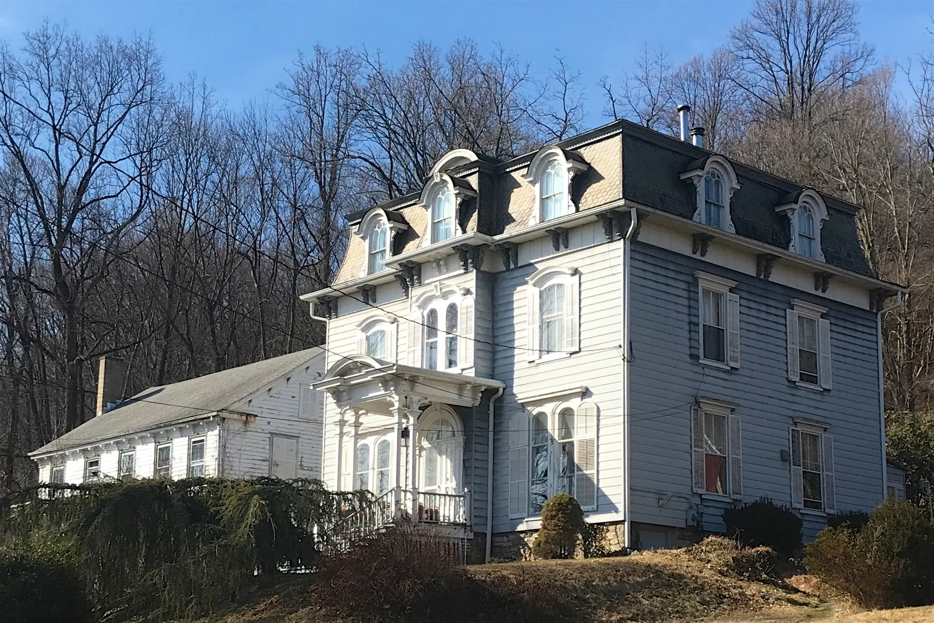 The house at 275 Main Street in Port Murray is a white Second Empire home with a mansard roof.