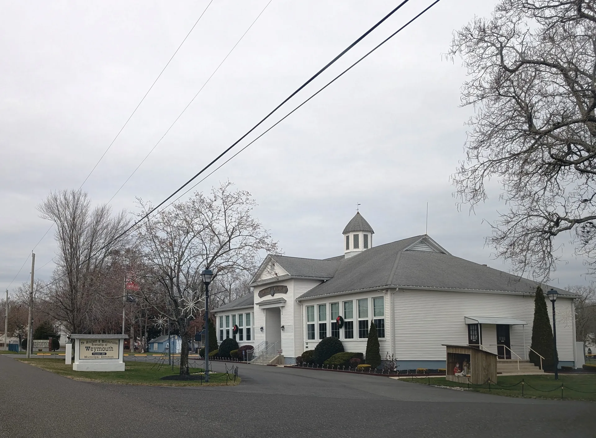 The Weymouth Township municipal building in Dorothy is a white clapboard building with a pillared entry and a small cupola.