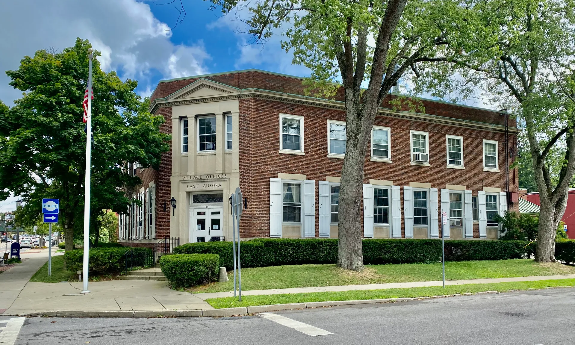 Brick Village Hall with white trim in East Aurora, New York.