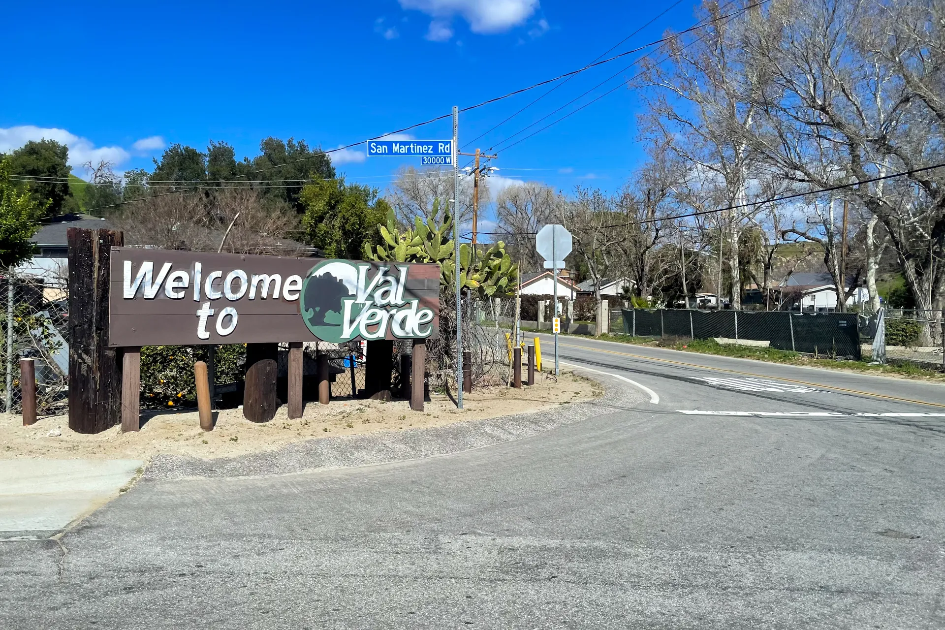 The welcome sign and residential street at the entrance to Val Verde, California.