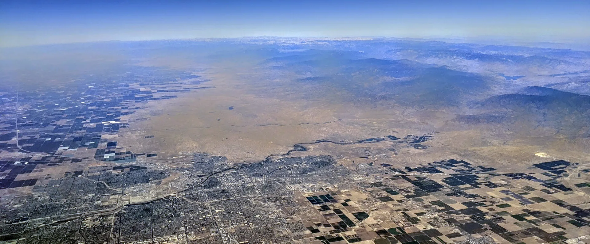 Aerial view of Bakersfield, California, and vicinity, showing the Kern River coming from the southern Sierra Nevadas